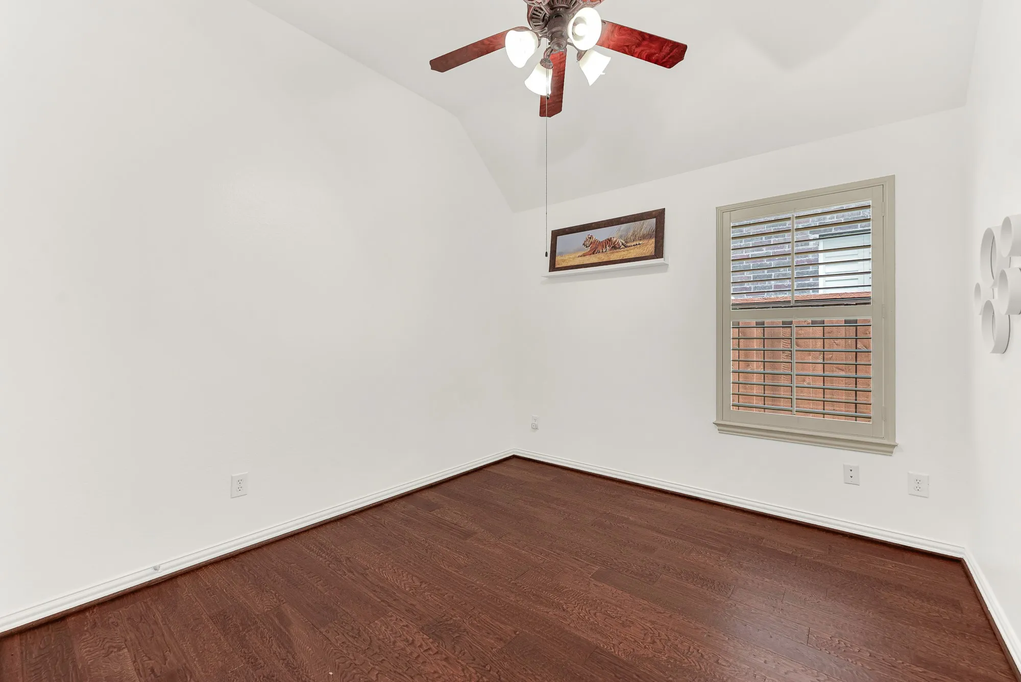 Vaulted ceilings and warm wood floors make this bright room feel larger while offering a versatile blank canvas. Whether it's a bedroom, nursery, hobby room, or office, you can make it your own from day one.