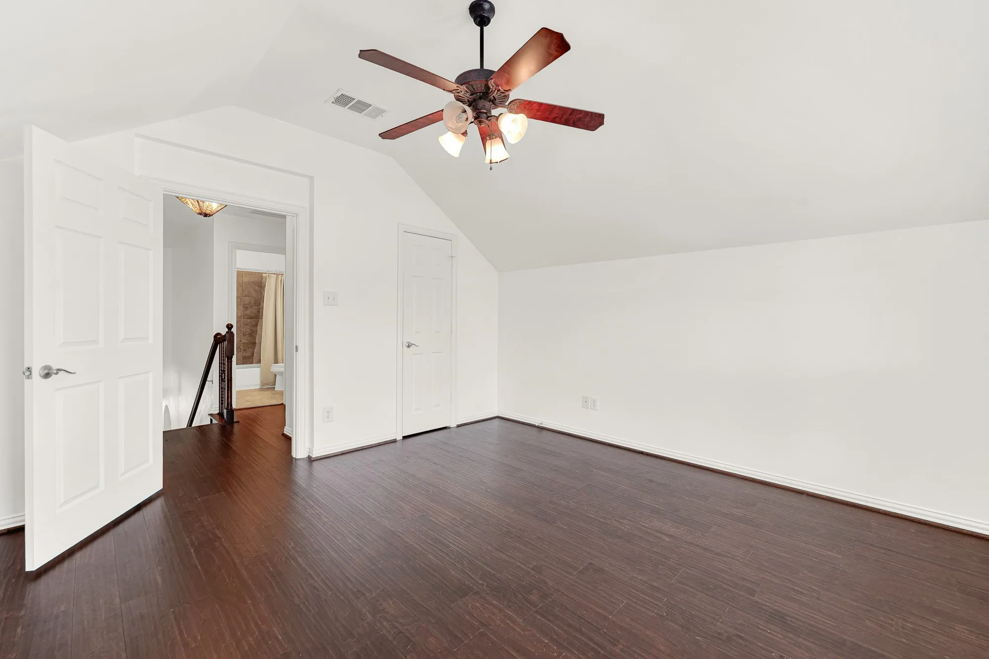 The upstairs bedroom is conveniently located just steps from its dedicated full bathroom, offering privacy and functionality. The spacious layout and adjoining bath make this an ideal setup for a mother-in-law suite, teenager, or long-term guests.