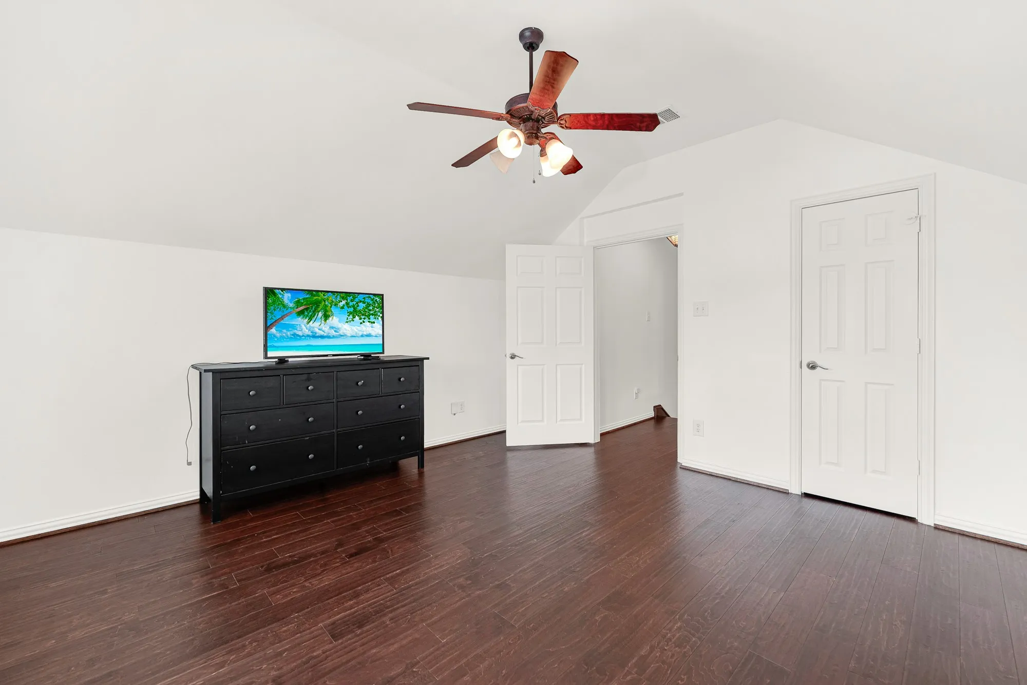 Enjoy a second view of this generously sized upstairs suite, showcasing the expansive floor plan, large closet, and private location. The room easily accommodates oversized furniture and provides a comfortable retreat away from the main living areas.