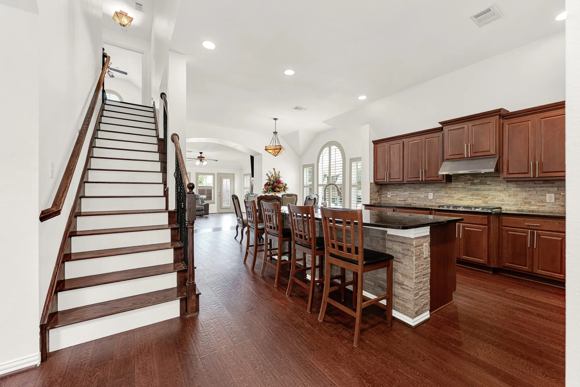 The real wood staircase leads to a private fourth bedroom and full bath, creating the perfect retreat for guests, teens, or a home office.