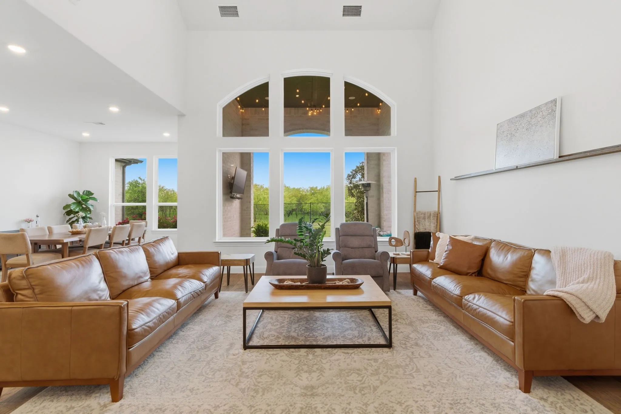 Bright, open living room overlooking gorgeous back yard.