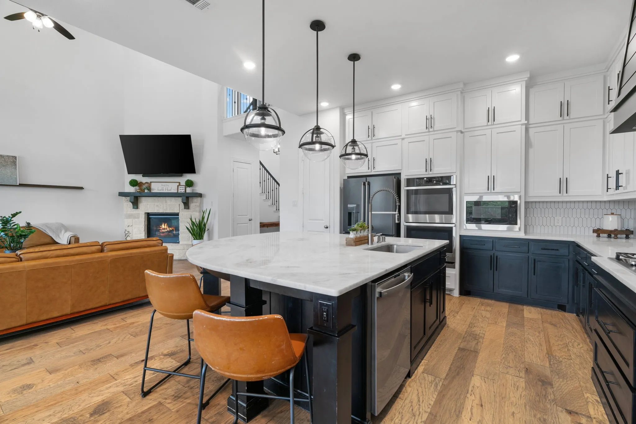 Stunning upgraded kitchen with oversized island and ceiling height cabinets.