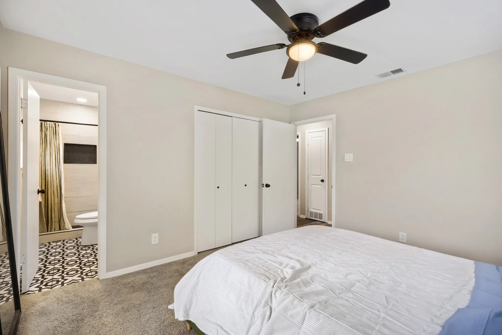 Primary bedroom overlooking ensuite bath