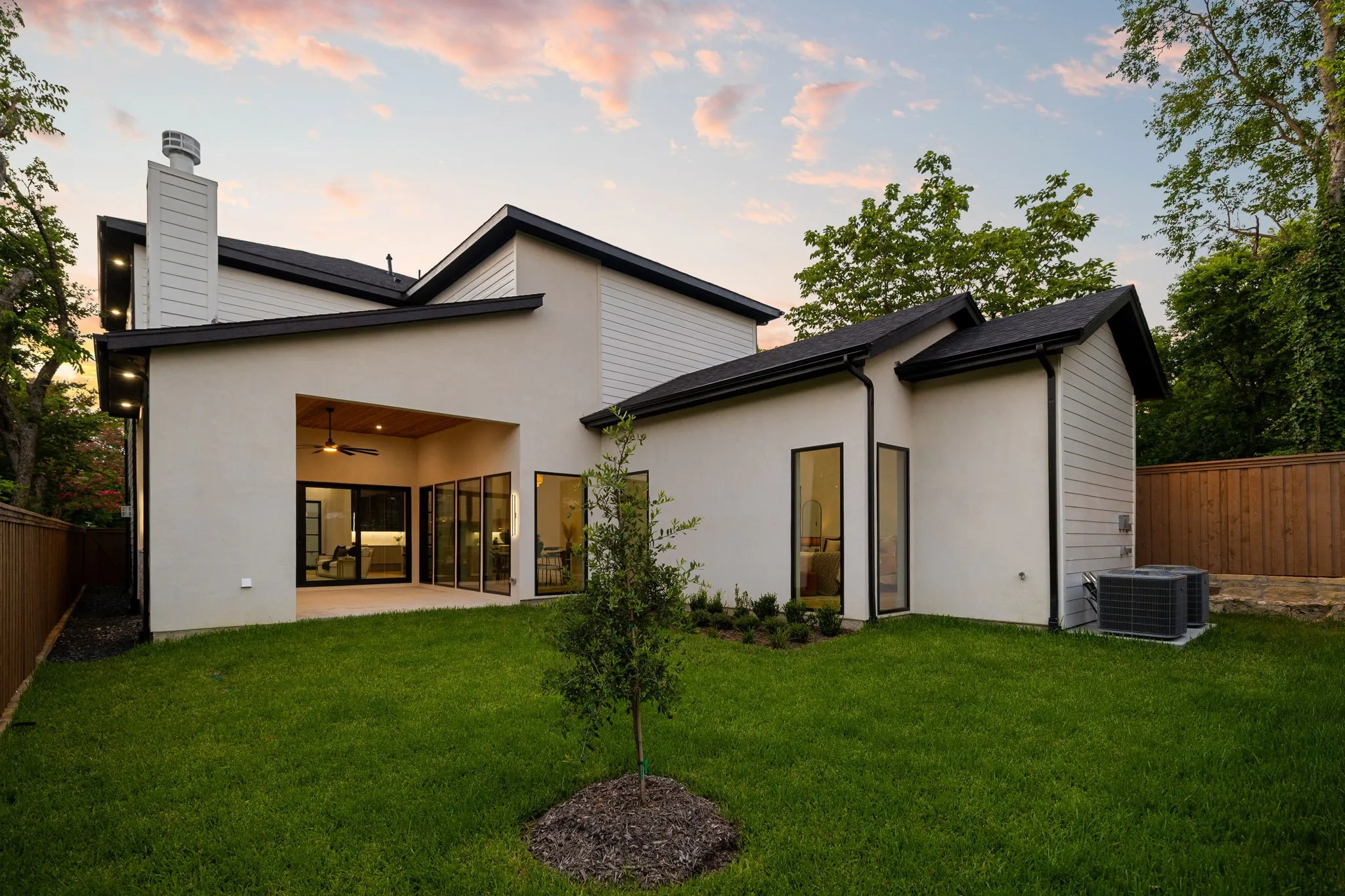 Contemporary exterior with a covered patio featuring a wood-finish ceiling and integrated lighting
