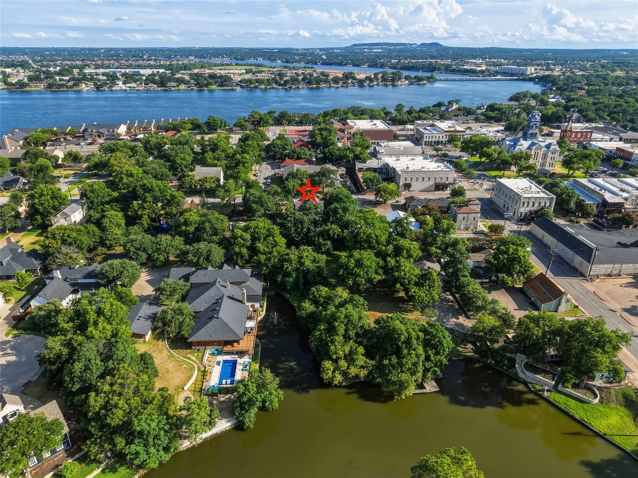 Aerial view from lake Granbury to the nearly acre lot just off of the square.