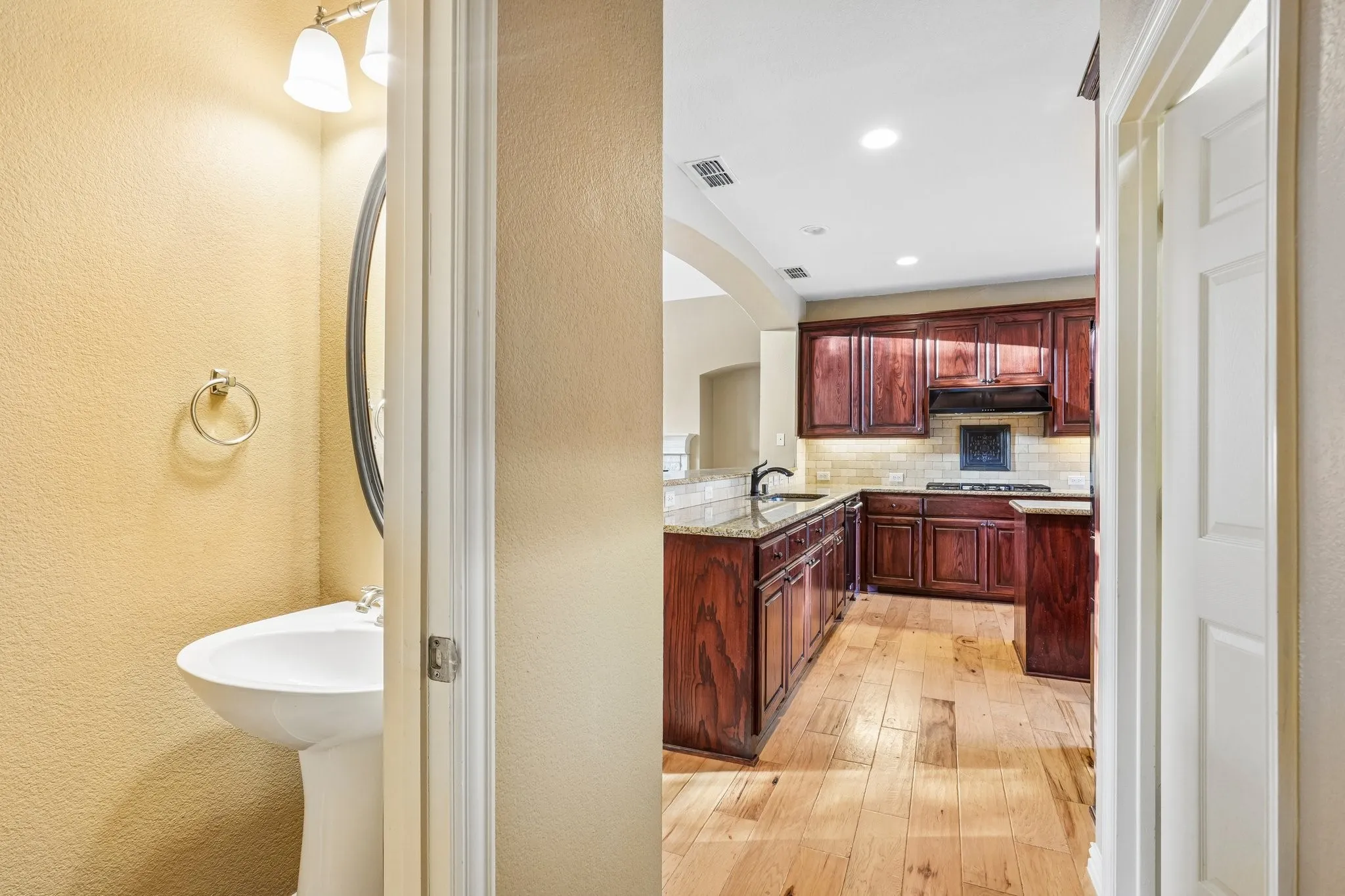 Hallway/Half Bathroom/Kitchen