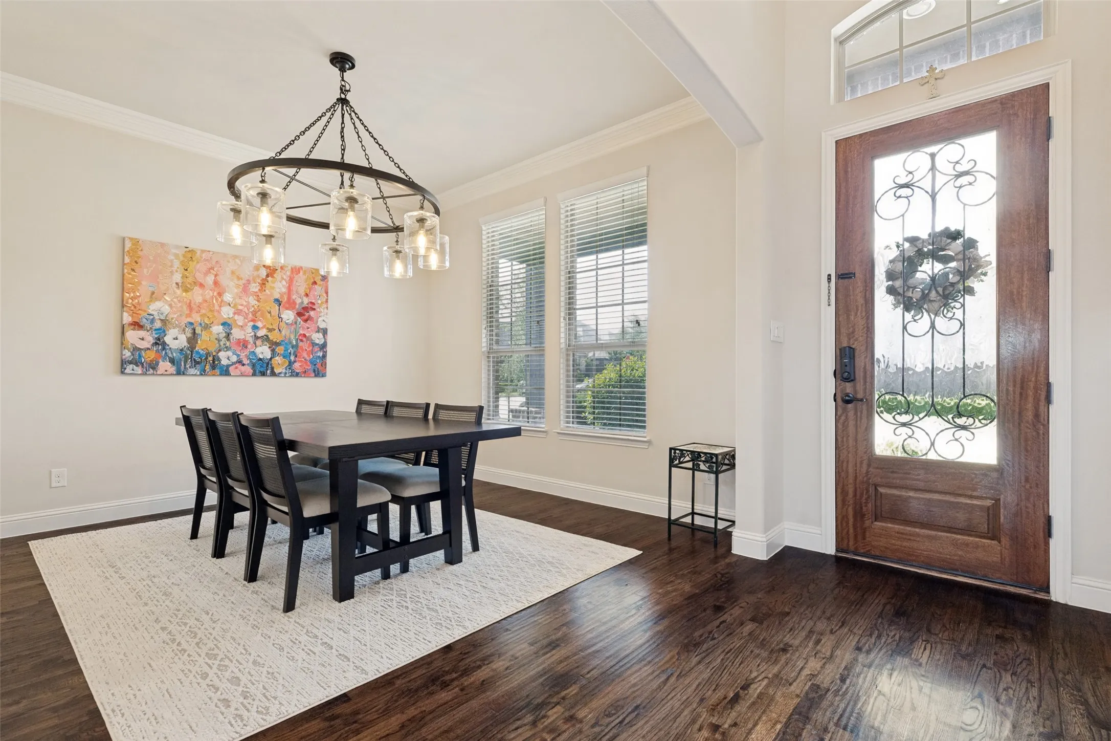 Rich hardwood floors in Dining Room into Living