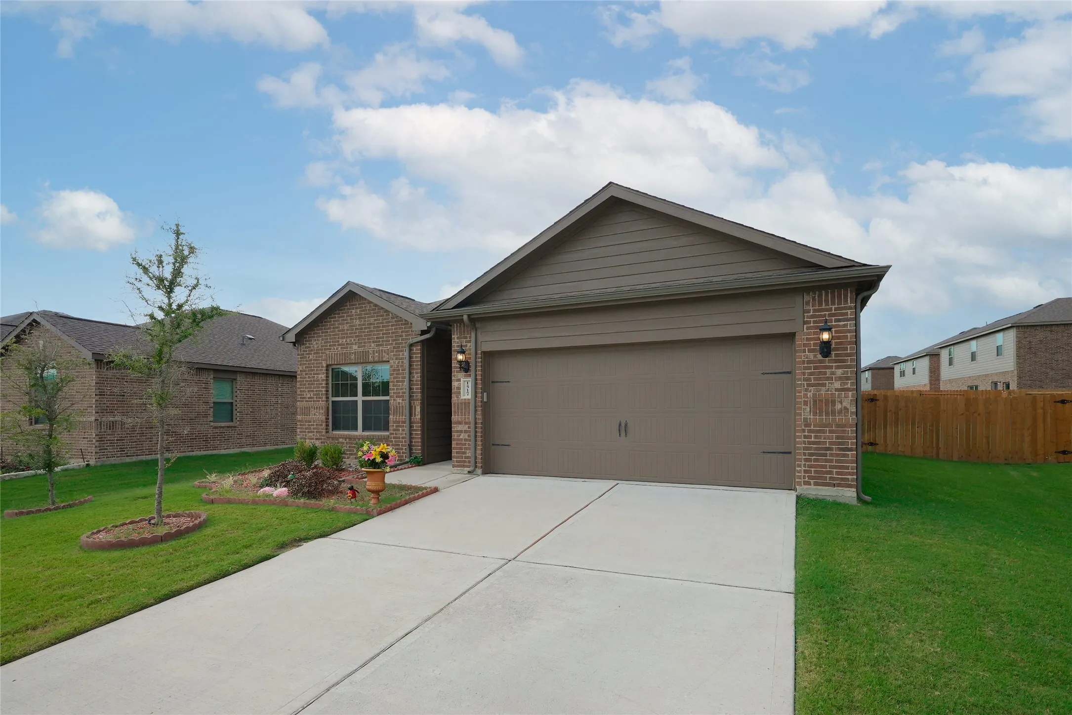 Brick and siding exterior with an attached garage