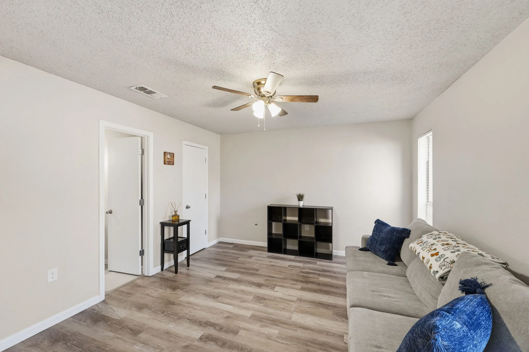 Additional bedroom featuring neutral finishes and ample natural light and walk-in closet.