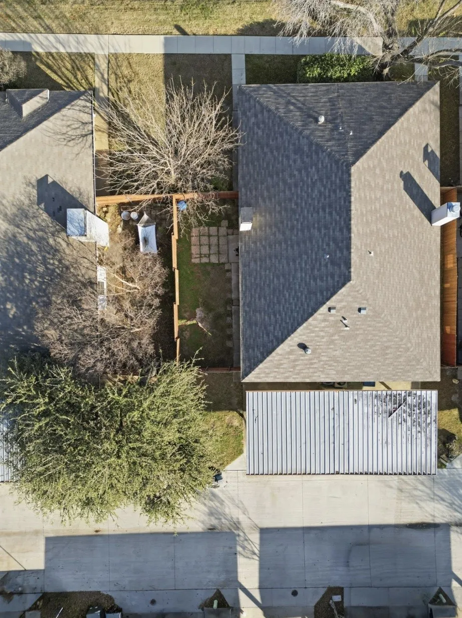 Overhead aerial perspective of the home, lot layout, and roof.