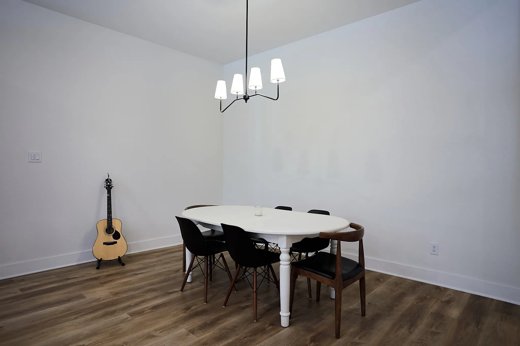 Neutral white walls with wood-finish flooring
