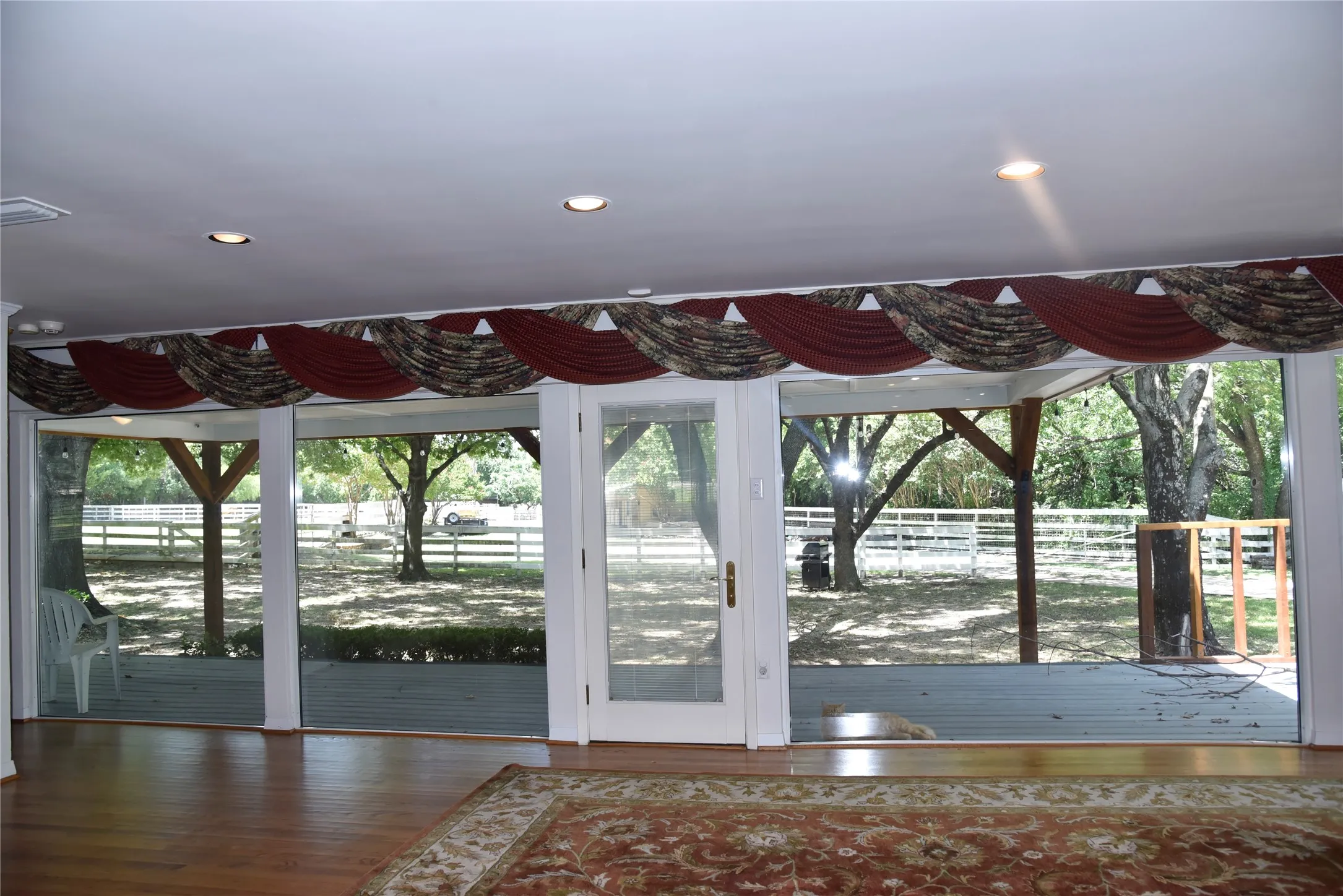Expansive glass doors opening to an outdoor deck