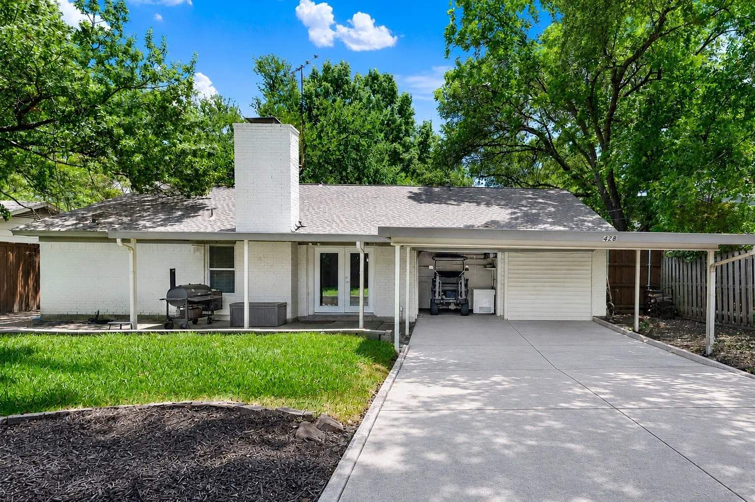 Golf cart garage and two covered parking areas