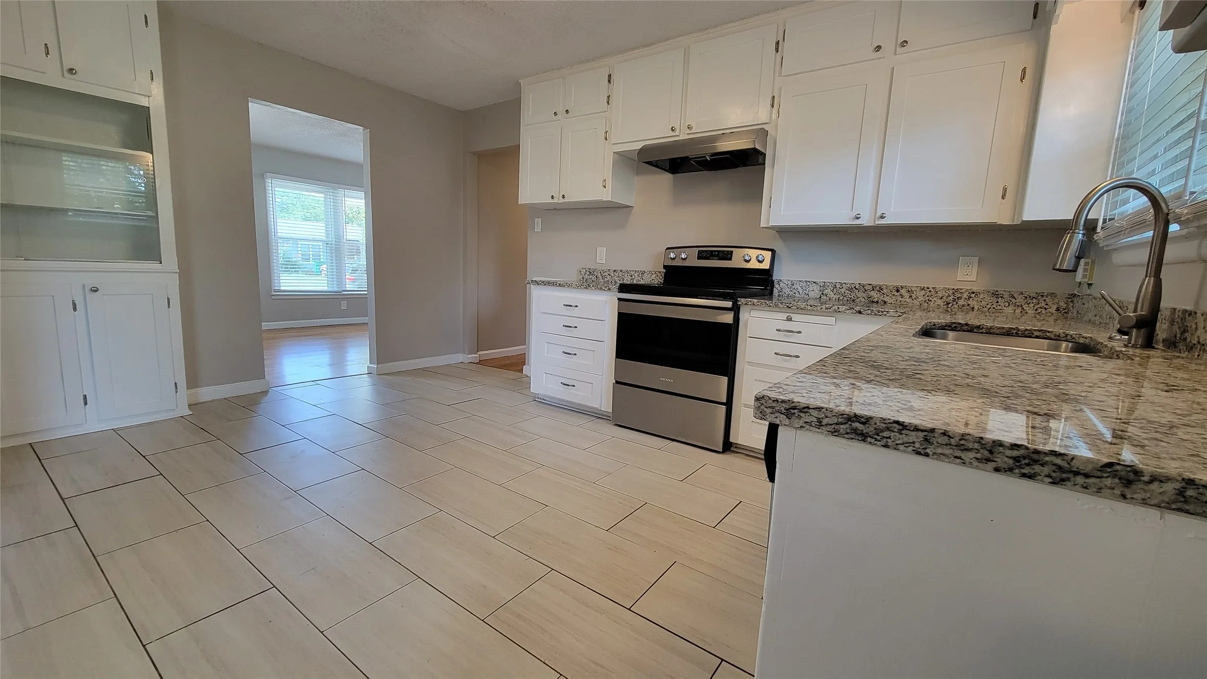 Kitchen with built-in display cabinets and lots of room