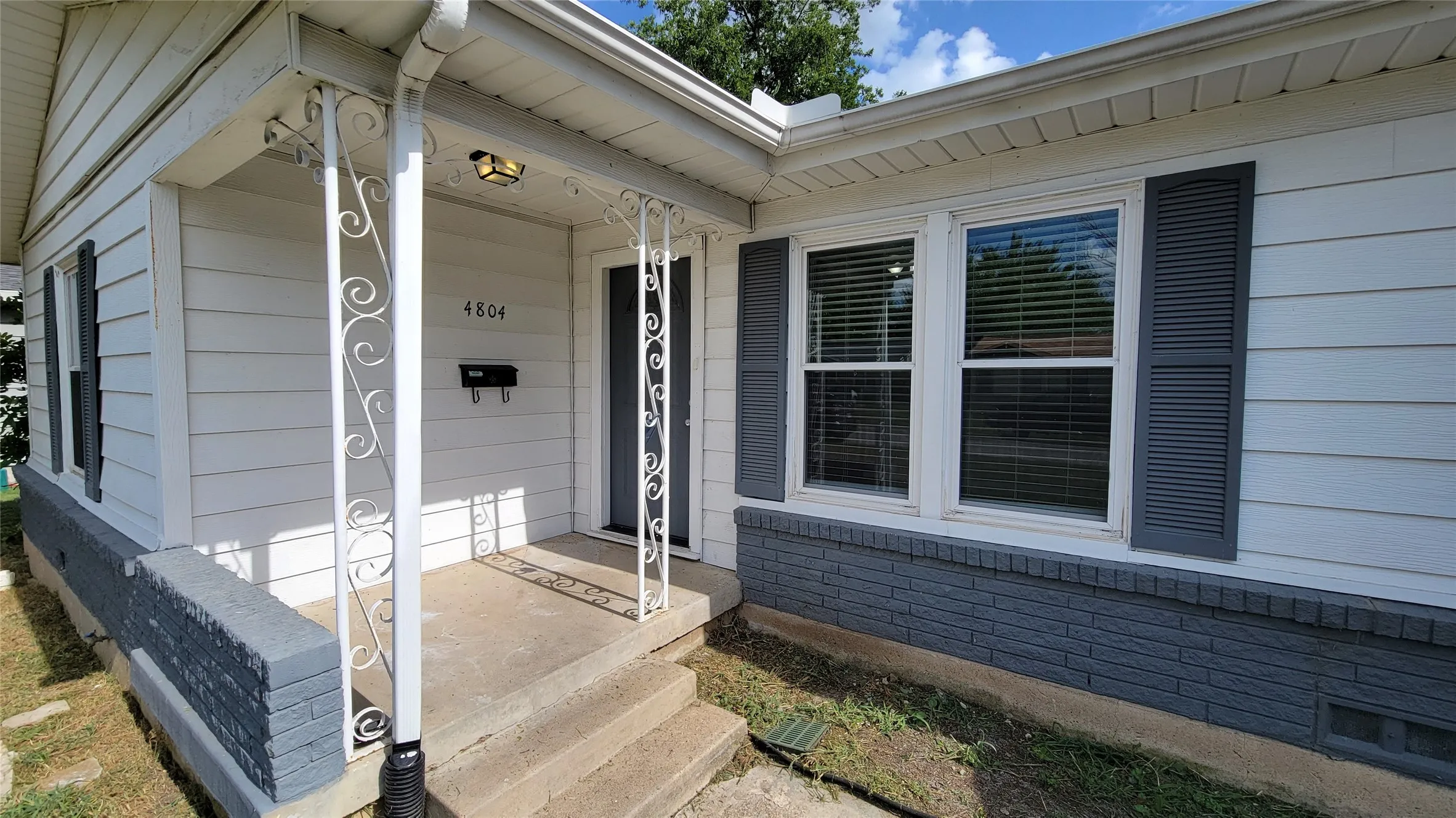 4804 Sabelle front porch, newer windows