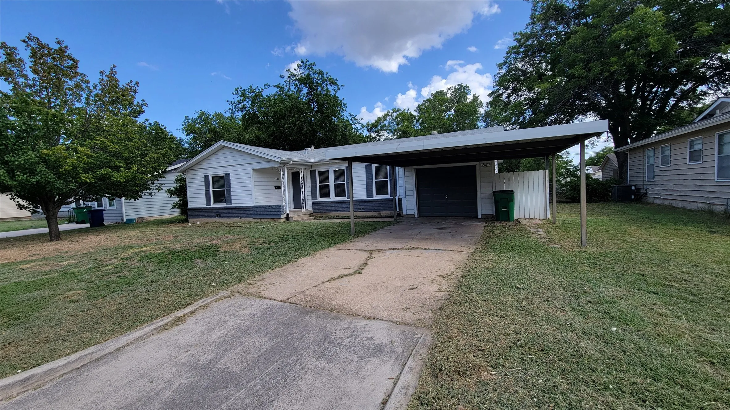 One-car garage and two-car carport
