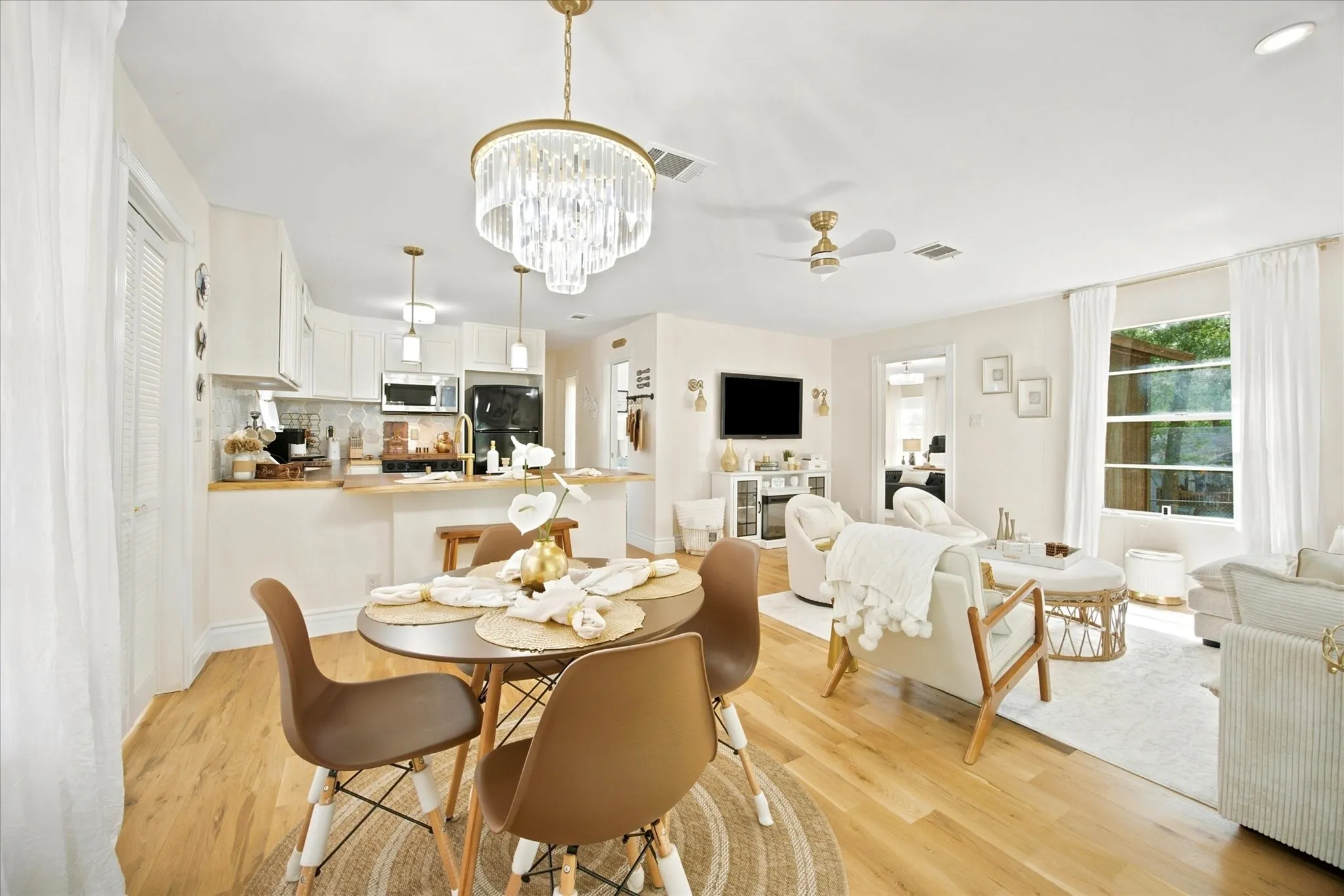 Open floor plan features kitchen overlooking dining area and family room