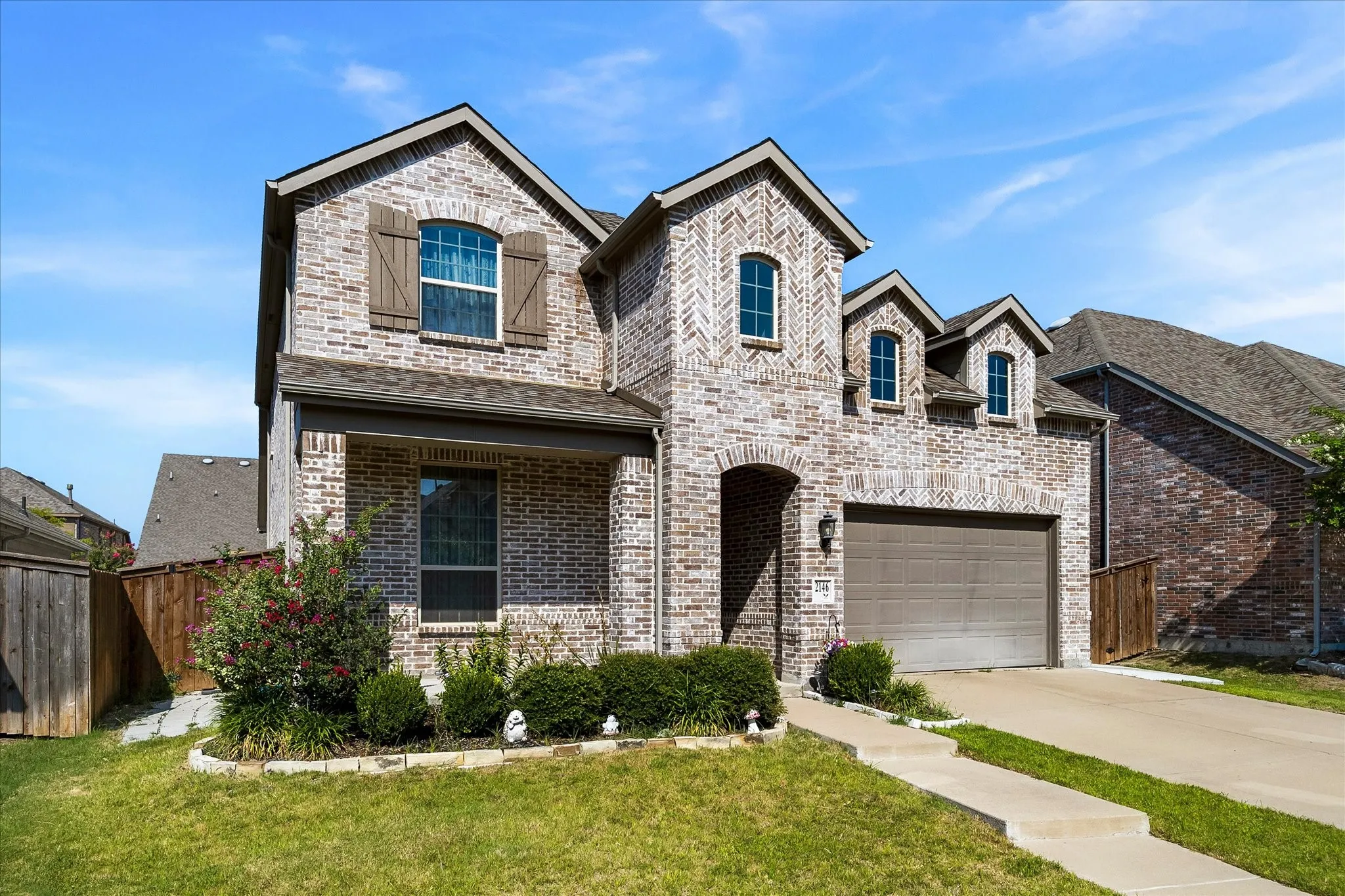 Two car garage and extended drive provides ample parking for your family and friends