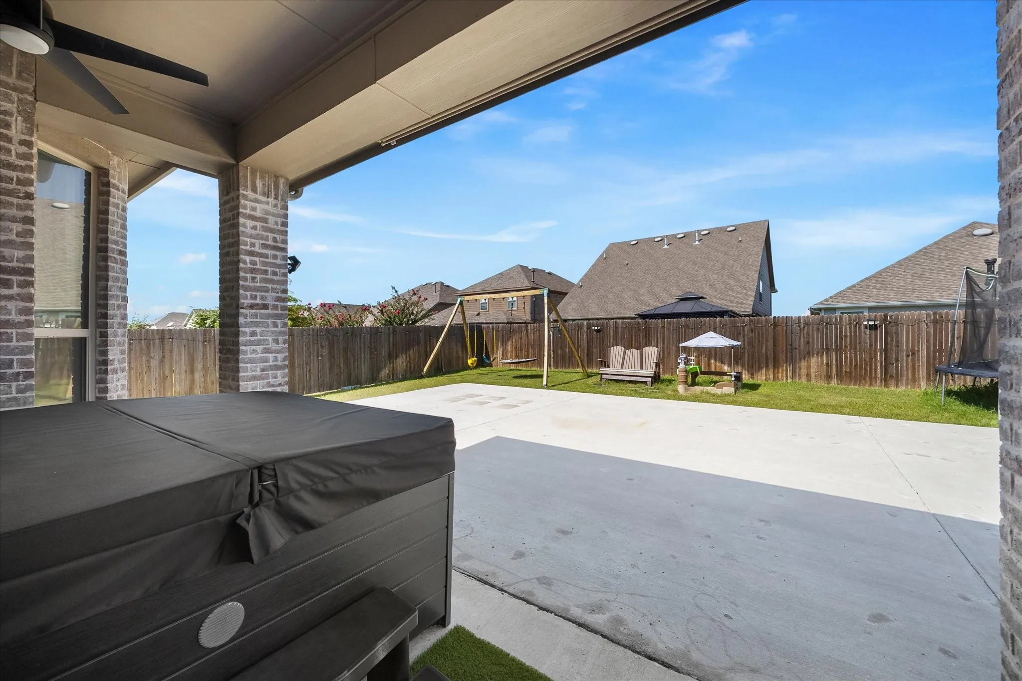 Covered patio opens onto extra large patio pad
