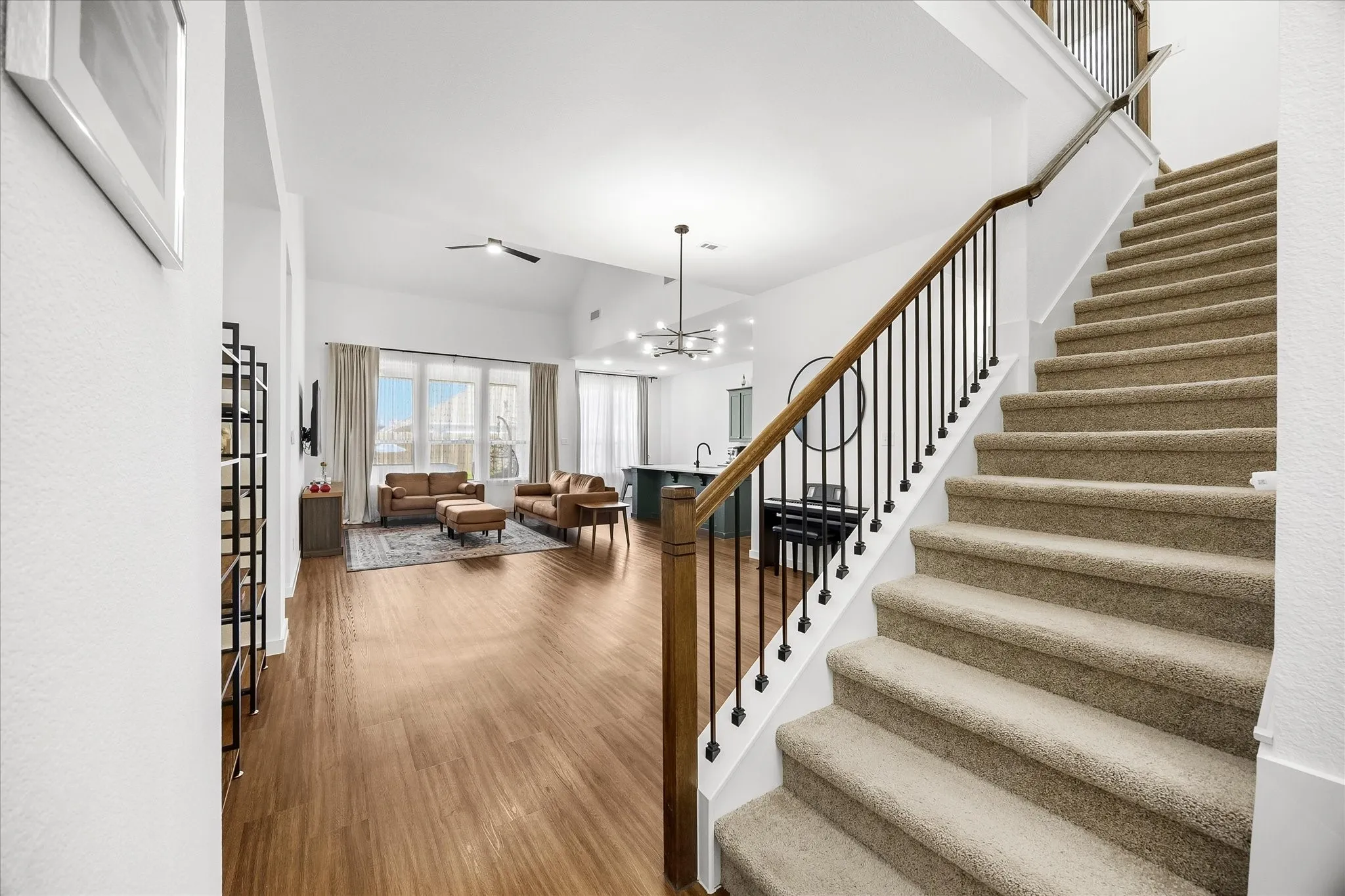 Majestic staircase overlooks famly room