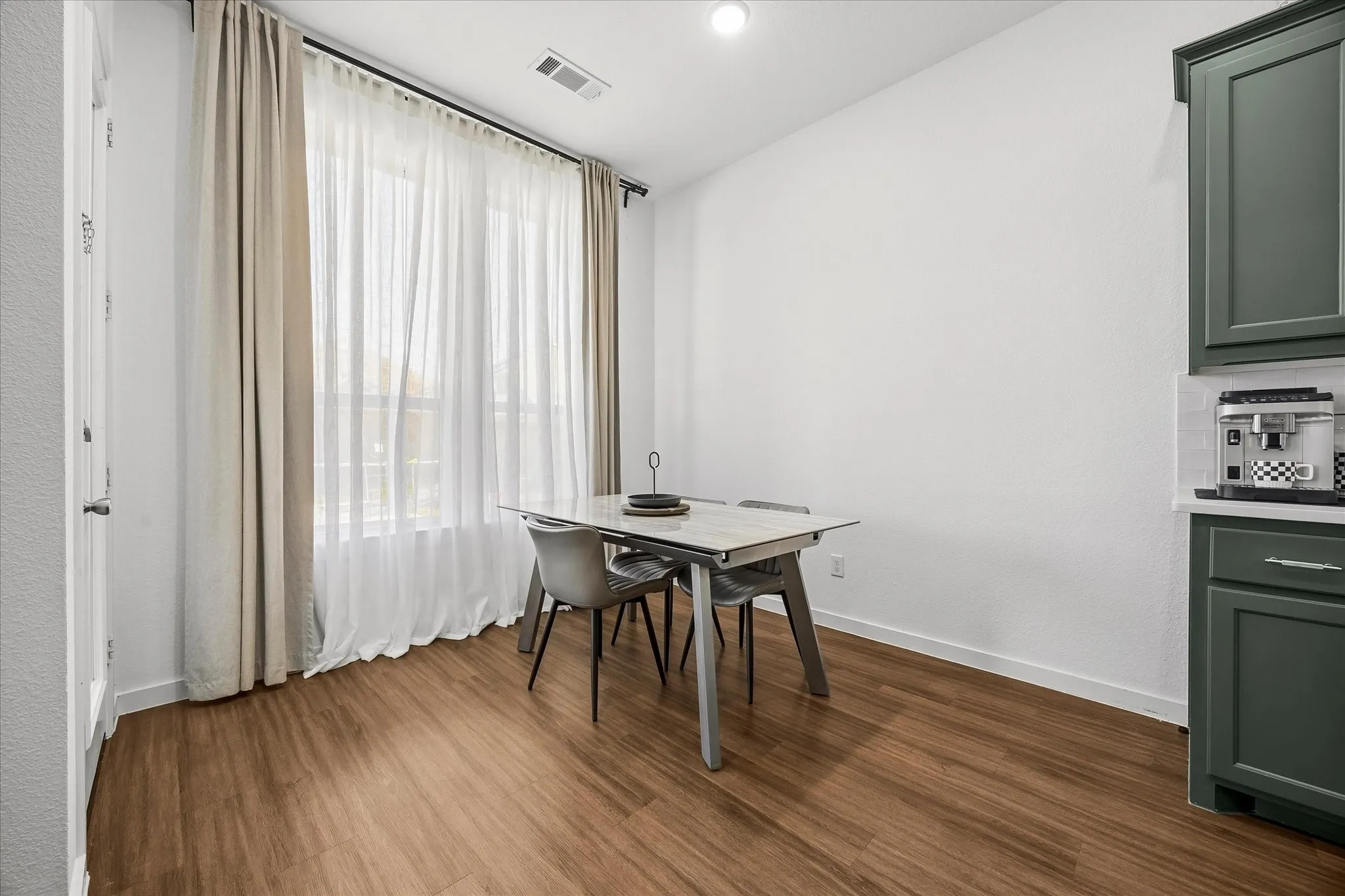 Lovely dining area opens onto kitchen