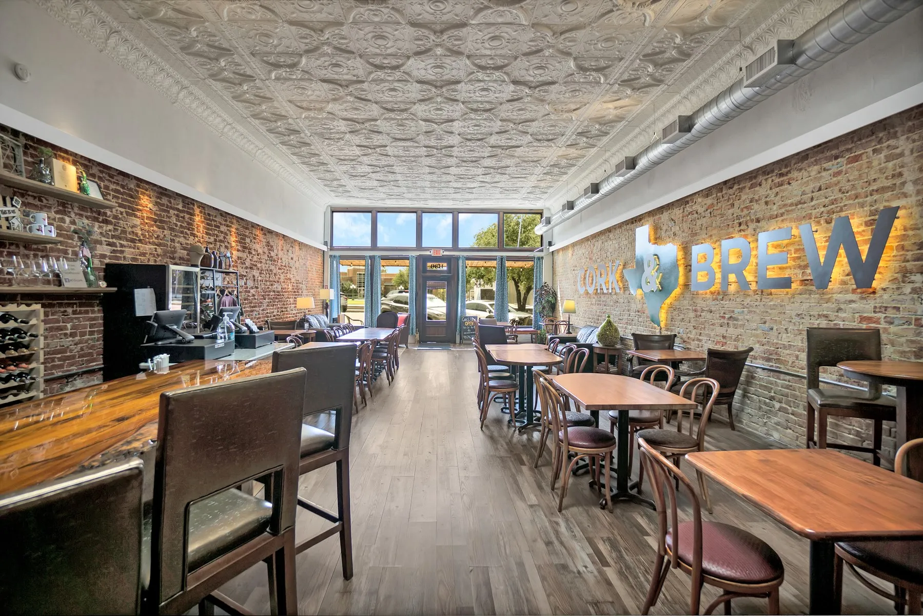 Original tile ceiling and brick walls add the perfect ambiance