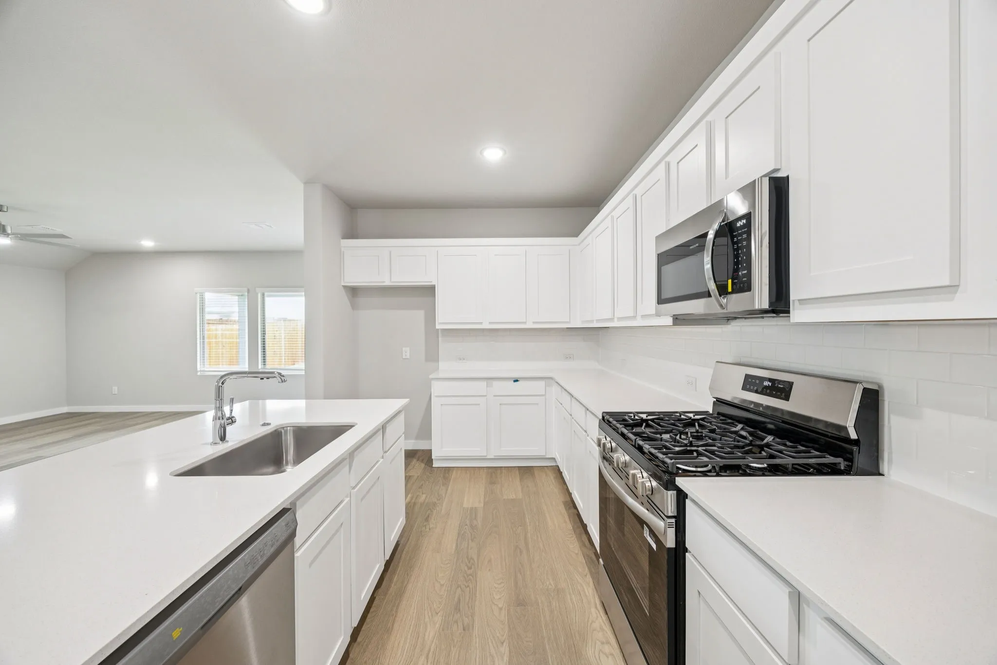 Kitchen in the Hayden home plan by Trophy Signature Homes – REPRESENTATIVE PHOTO