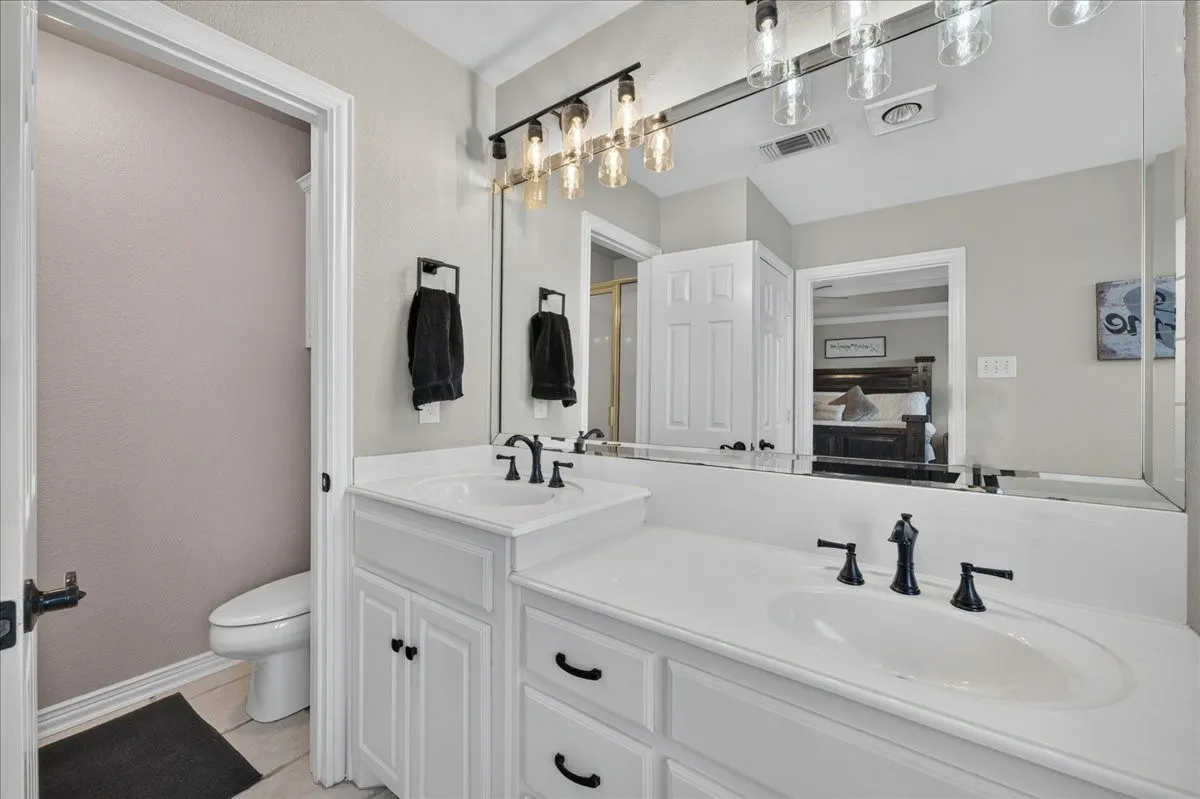 Primary bath with dual sinks and separate tub and shower
