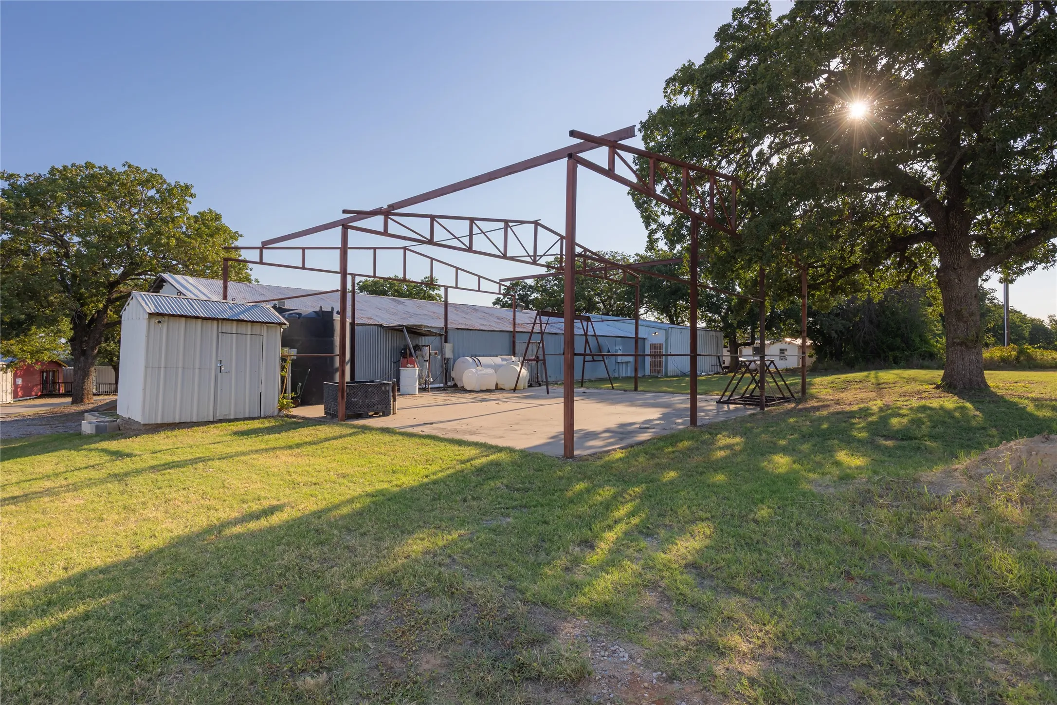 Open-air metal frame structure with concrete slab