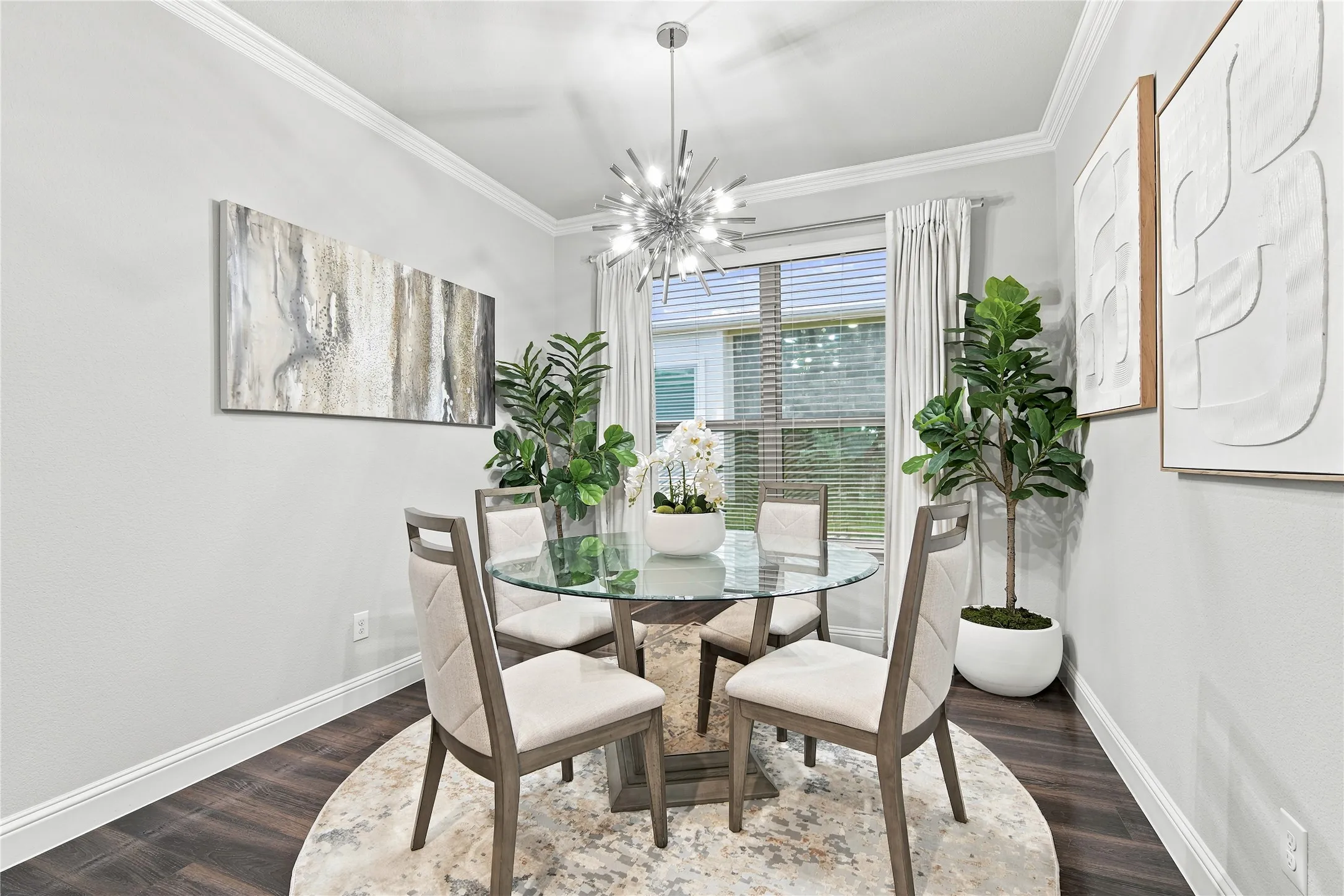 Dining area featuring dark wood-finish flooring and light gray wall paint