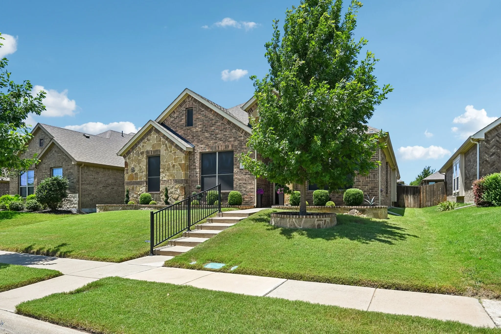 Brick and stone exterior with gabled roofline