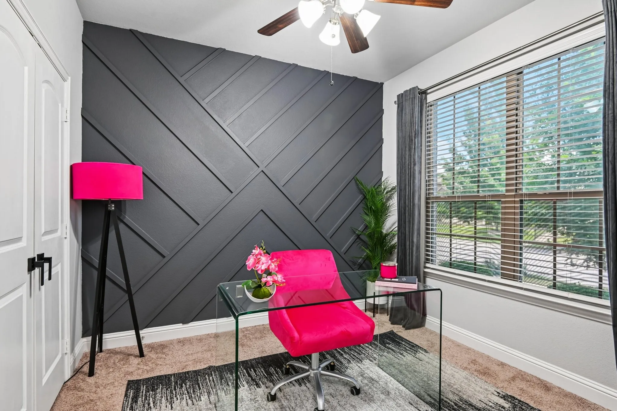 Accent wall featuring dark gray geometric paneling