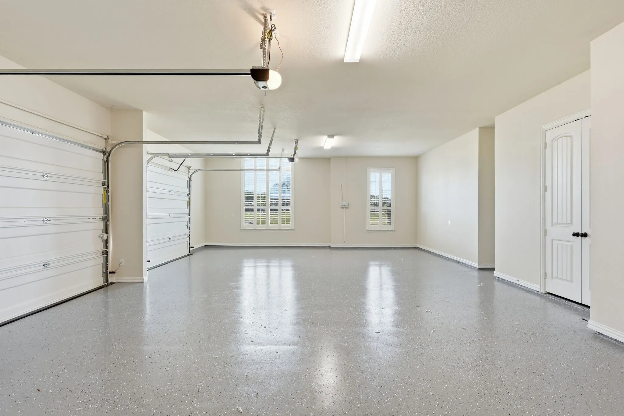 fresh new epoxy floor in attached 3 car garage