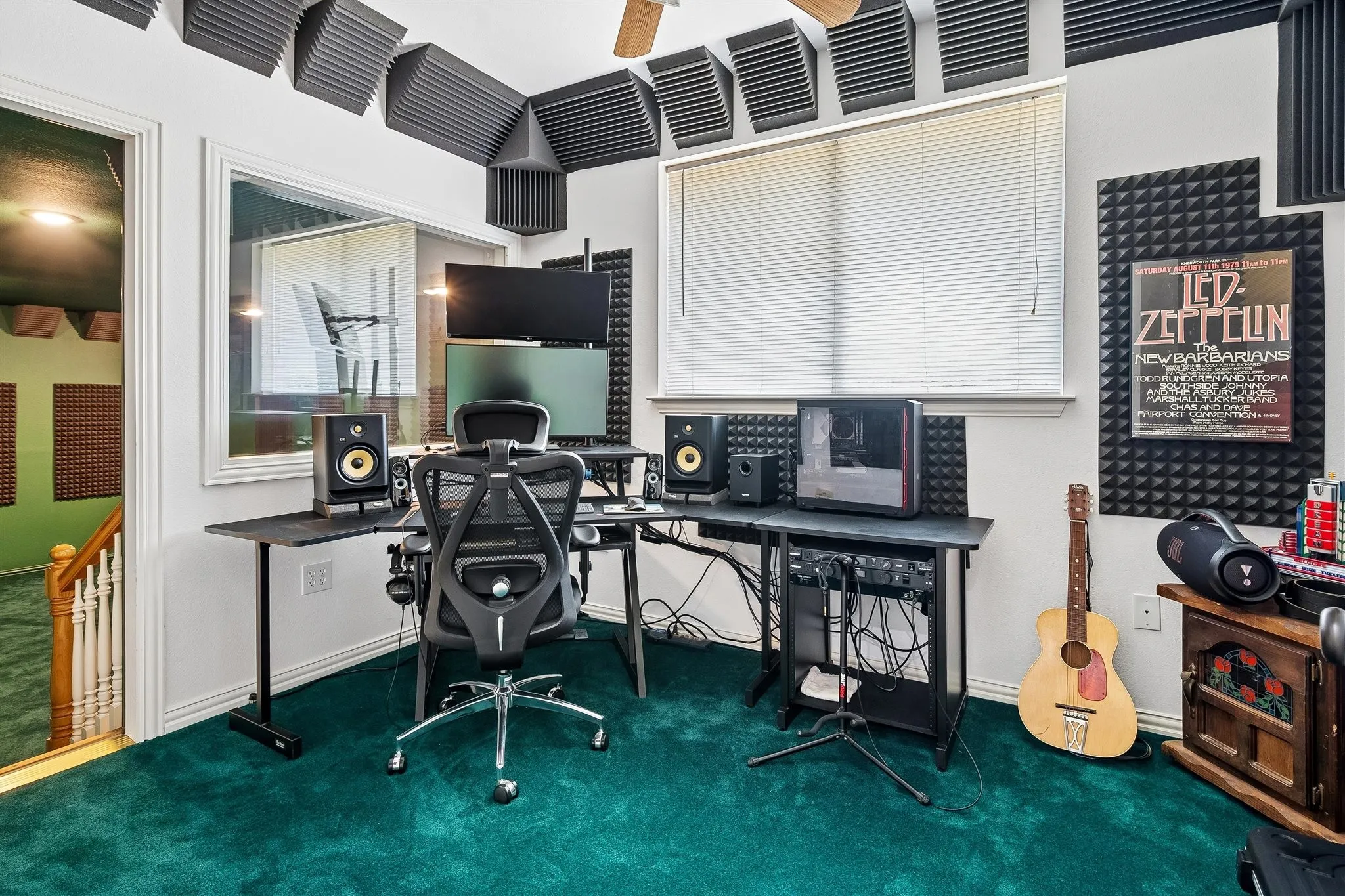 Control room overlooking recording studio
