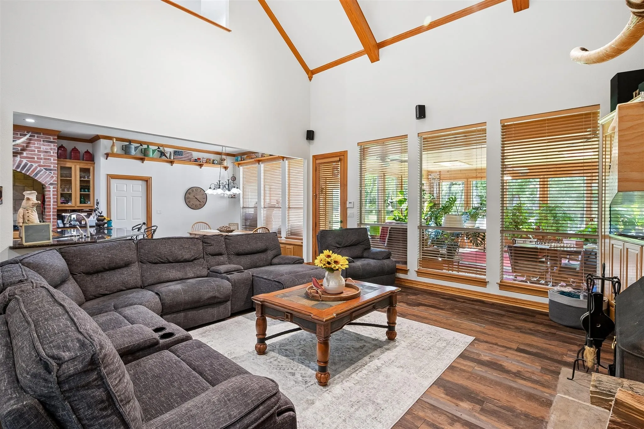 Open floorplan with seamless flow between kitchen, dining and living