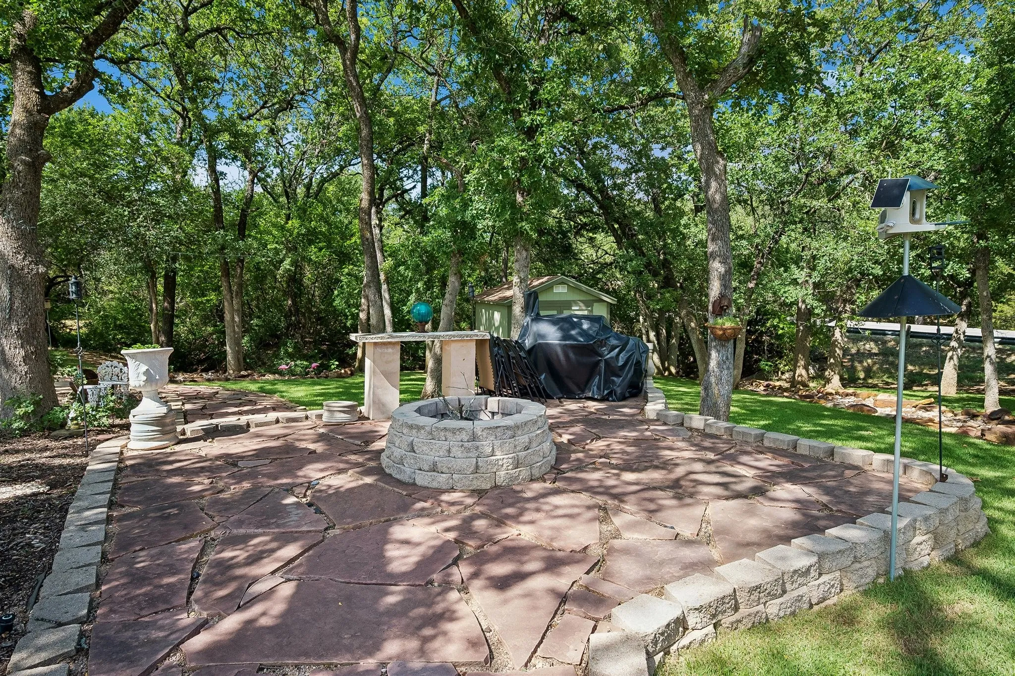 Backyard oasis with firepit is perfect for entertaining