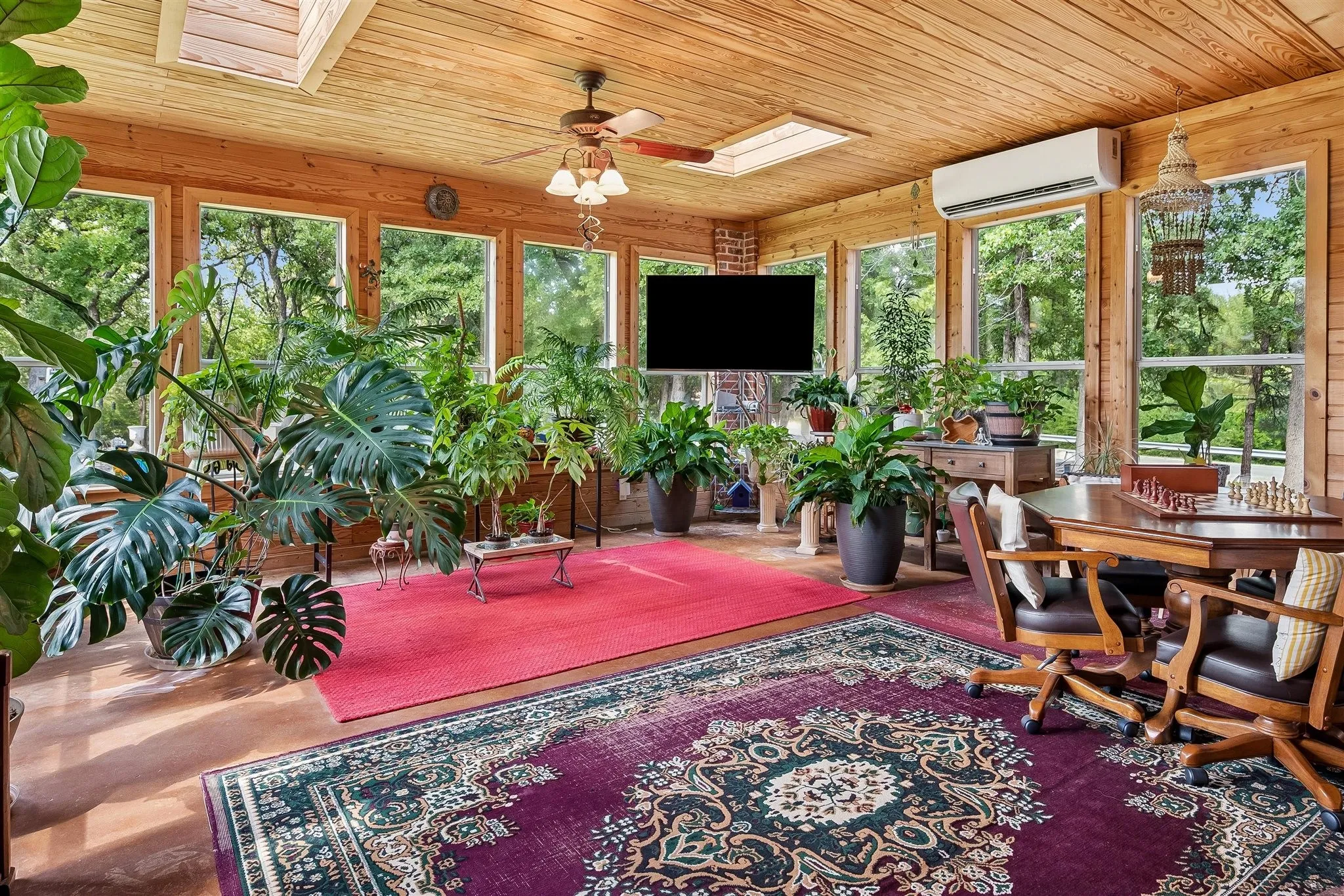 Air conditioend sunroom with beautiful wood ceiling