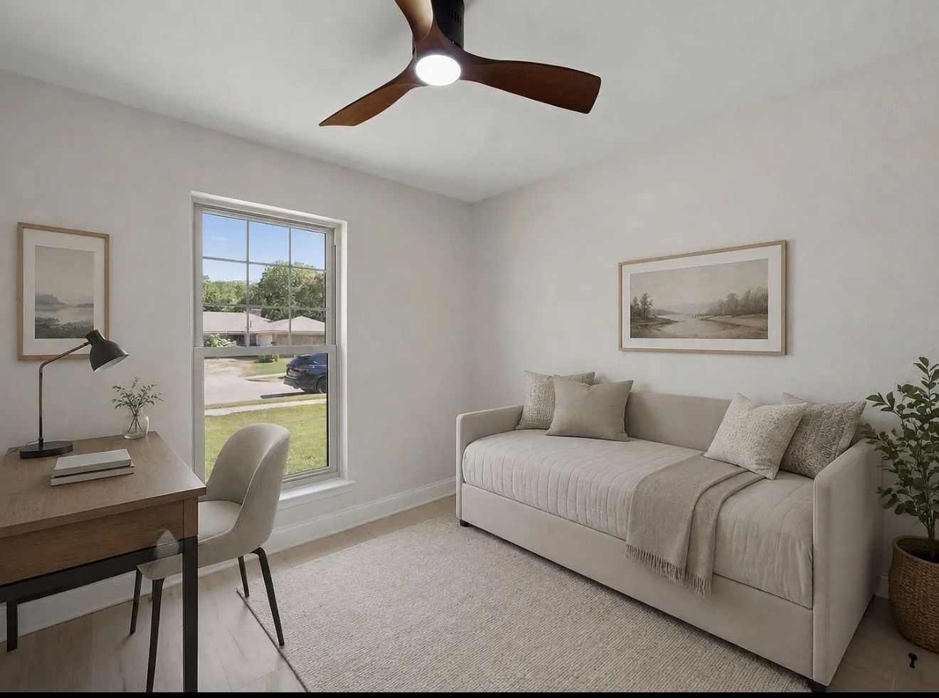 Wood-finish flooring, neutral wall tones, and a ceiling fan with integrated lighting