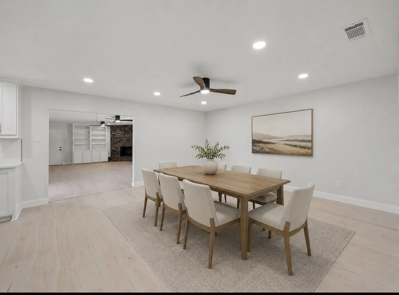 Recessed lighting throughout, wood-finish flooring, built-in cabinetry, and a ceiling fan