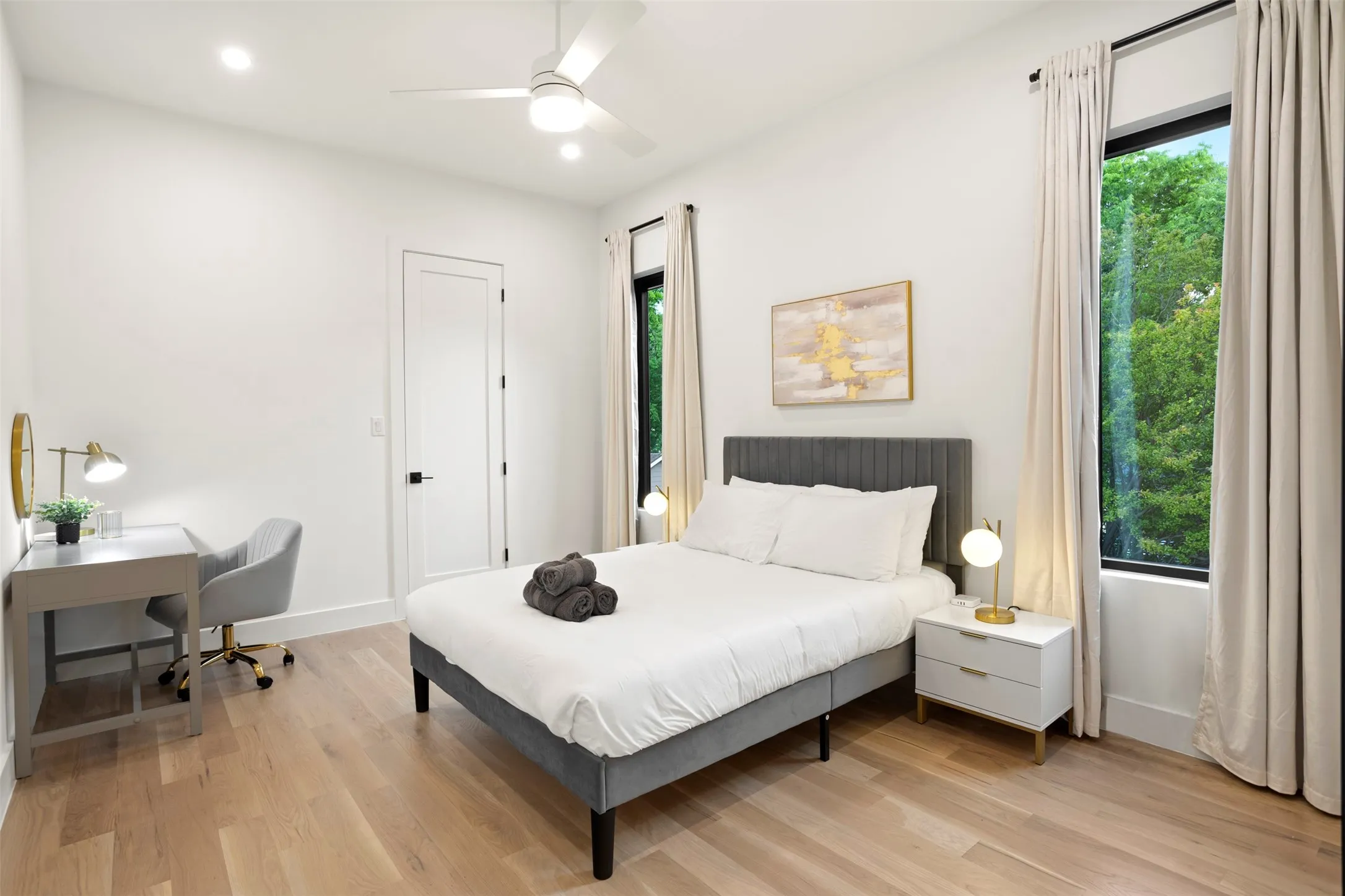 Light wood-finish flooring complements the bright white walls and ceiling