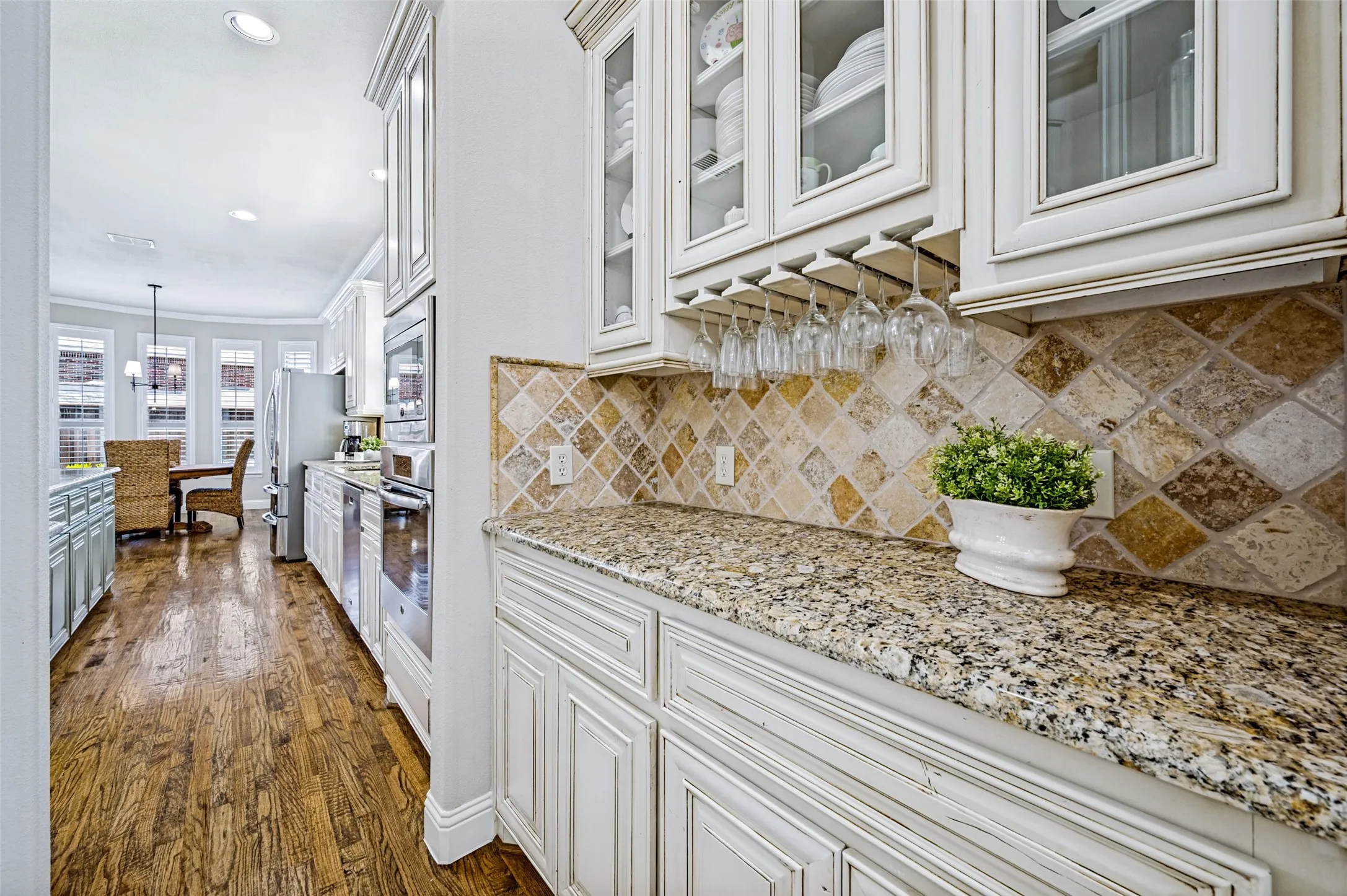 Butler pantry links kitchen to formal dining room.