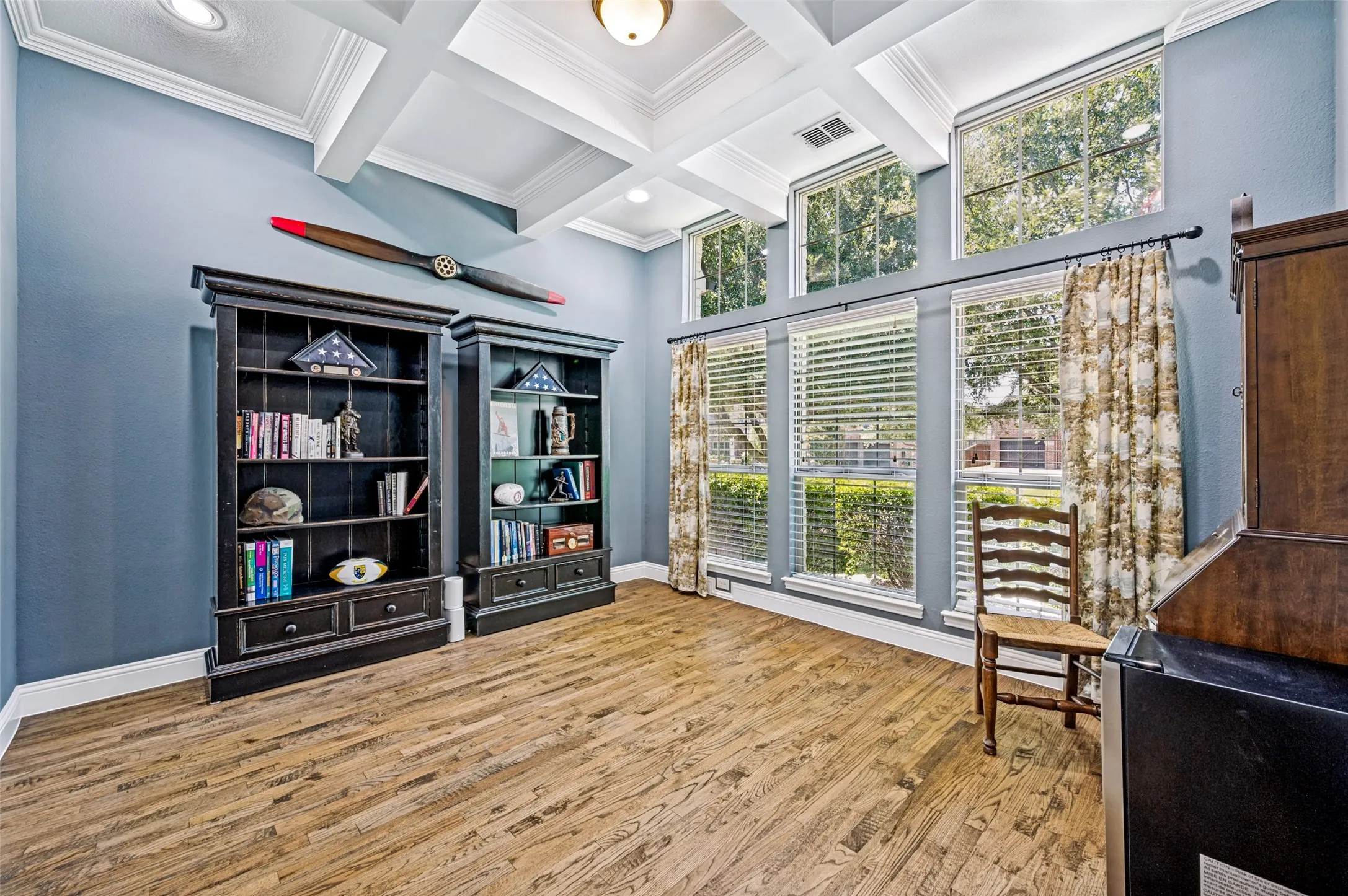 Spacious office with a closet and door to full bath. Could be a 5th bedroom. Coffered ceilings.