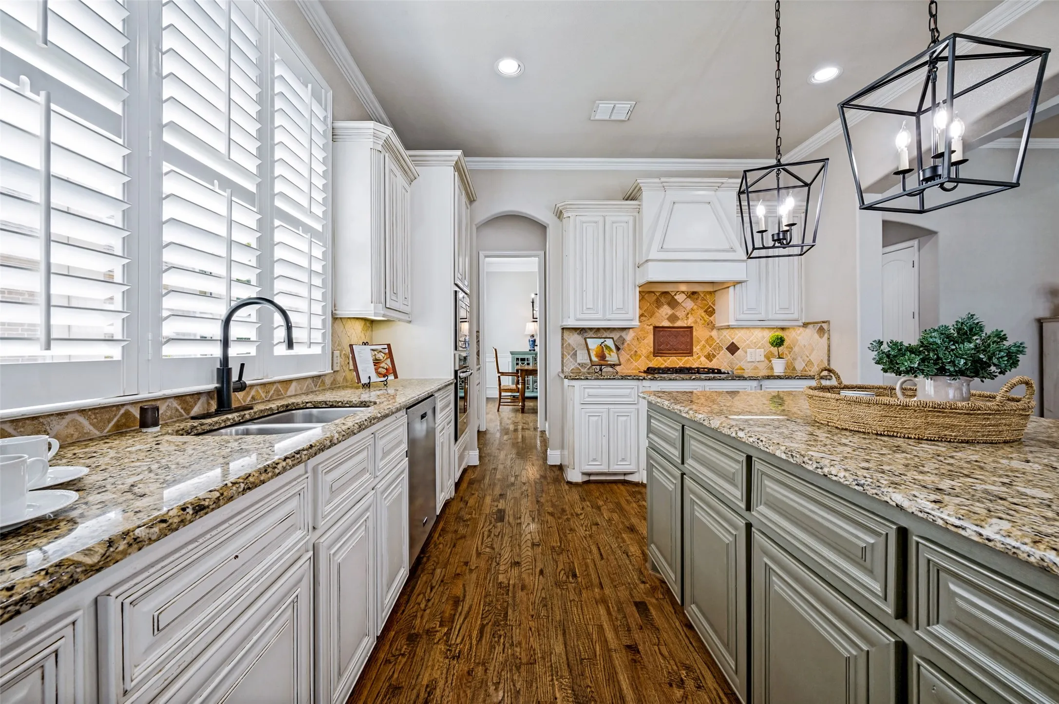 Granite counter tops and plantation shutters.