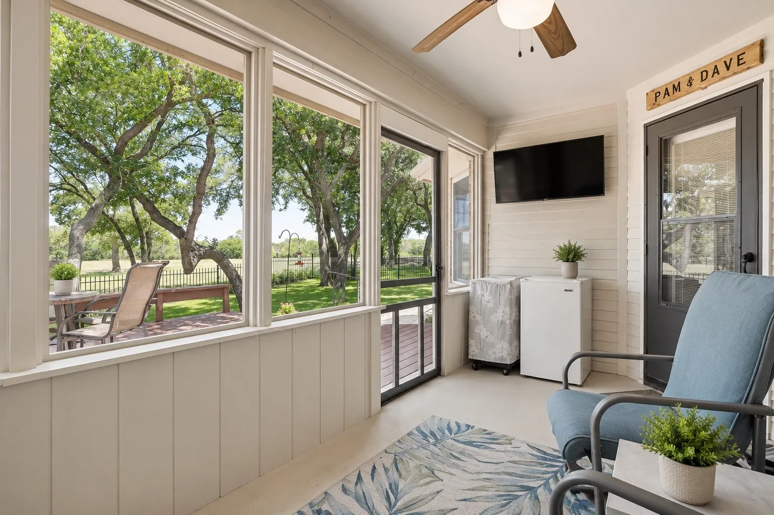 14x8 screened in patio with TV and ceiling fan