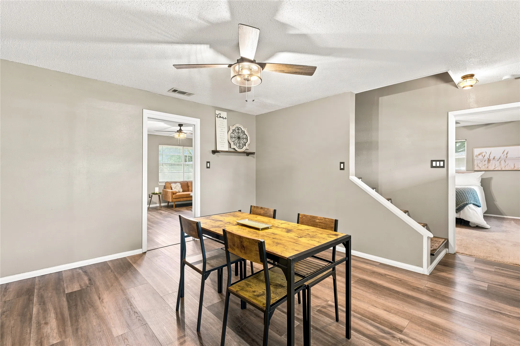 Dining area featuring wood-finish flooring, recessed lighting, and a ceiling fan