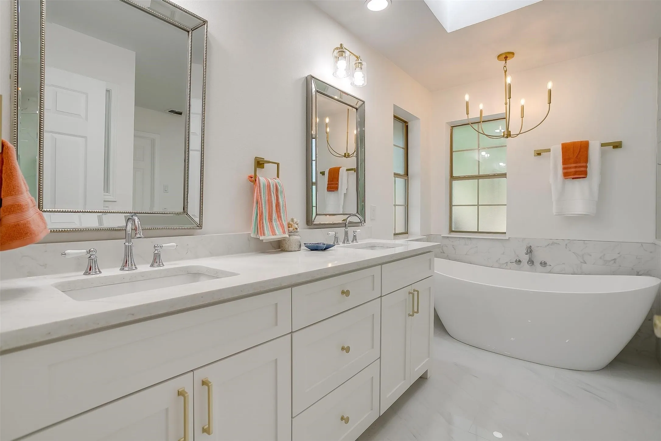 Dual vanity with rectangular undermount sinks and polished chrome faucets