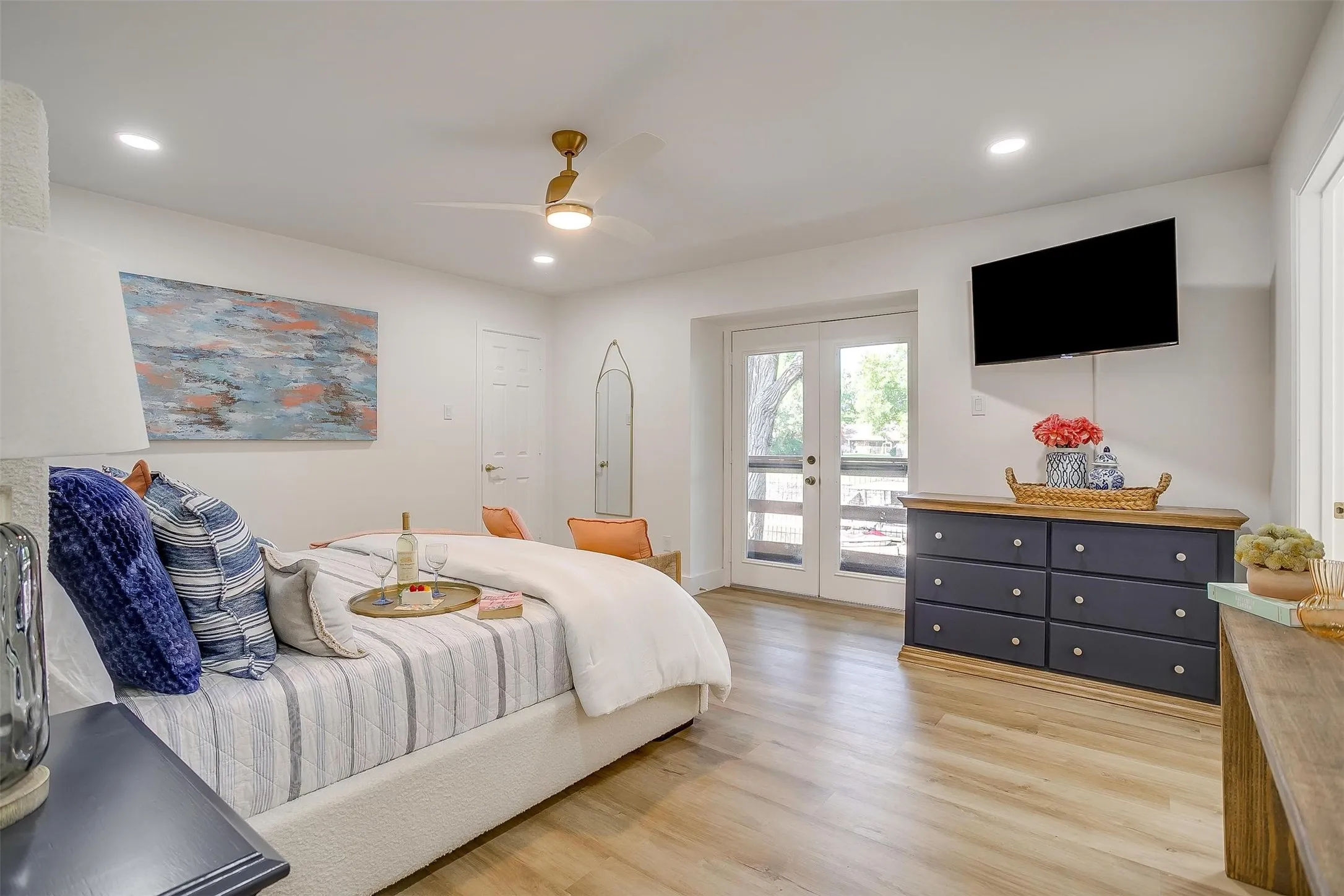 Spacious interior featuring wood-finish flooring, recessed lighting, and a modern ceiling fan