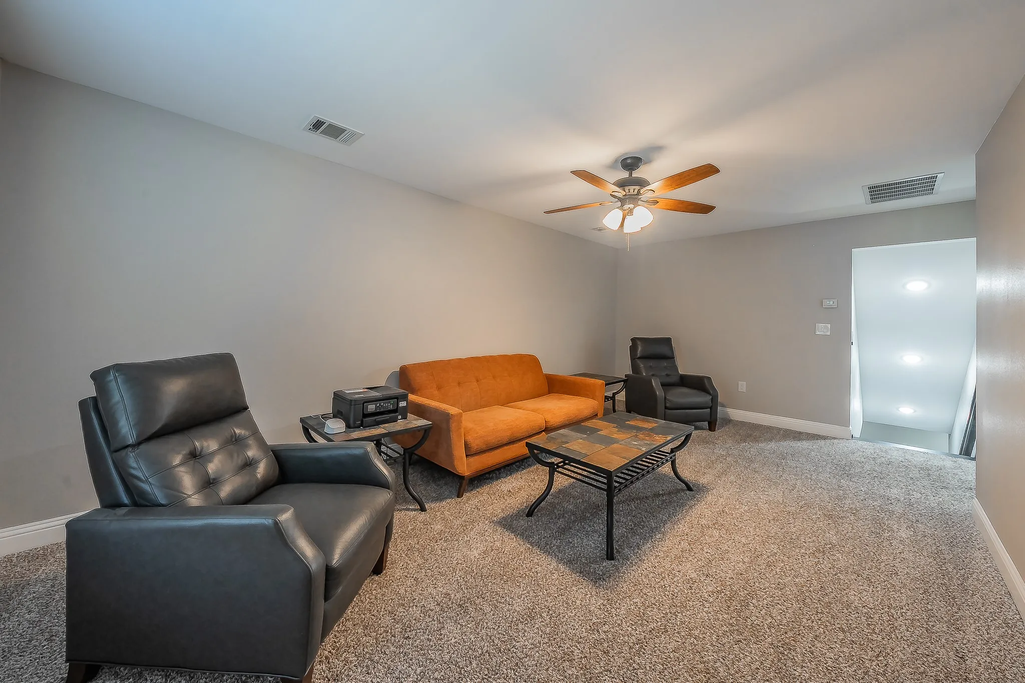 Carpeted room with a ceiling fan, recessed lighting, and light gray wall paint