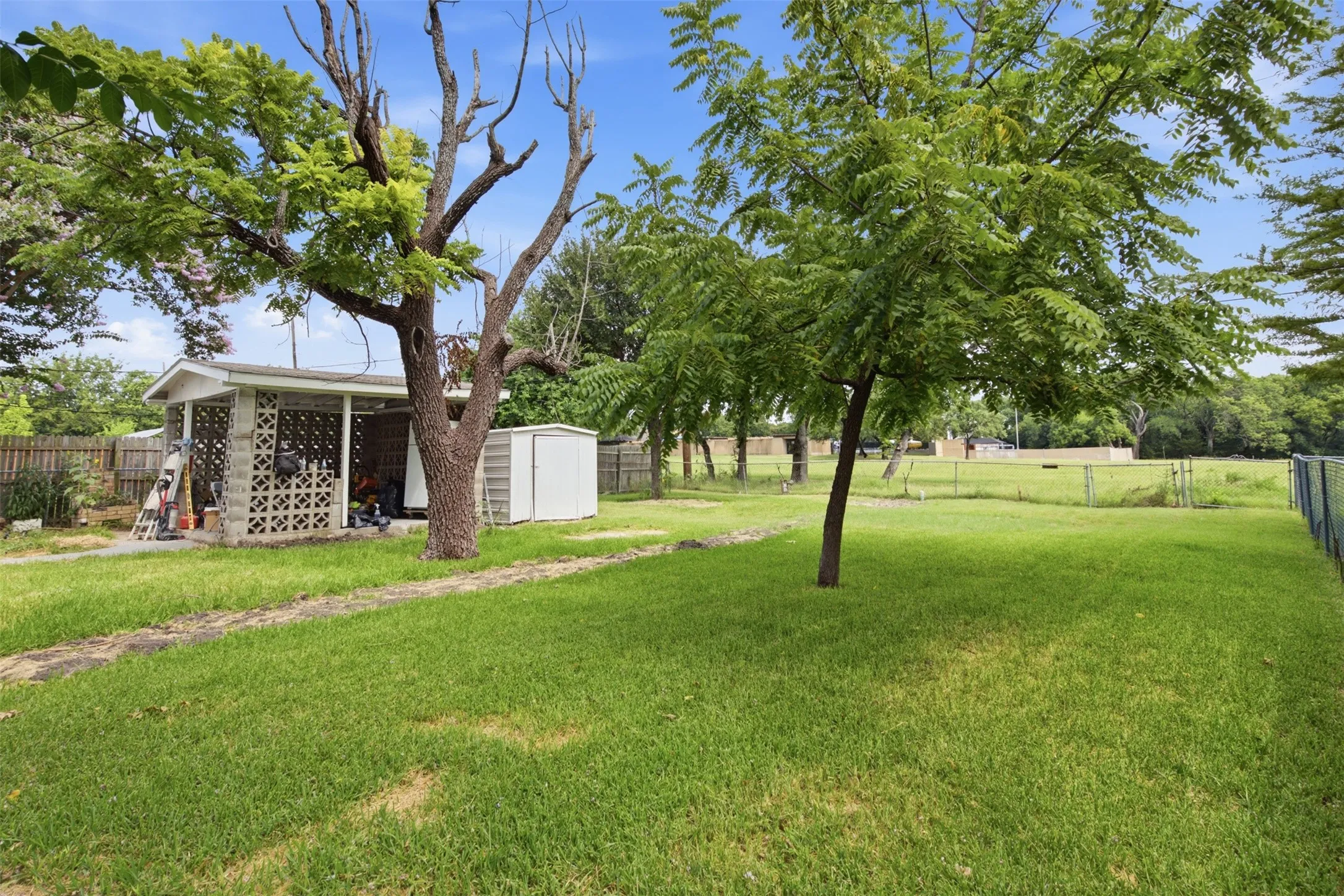 Views of Bradfield Park Behind the Home — With no immediate rear neighbor and open green space beyond the fence, the backyard enjoys a more peaceful, spacious feel. Walk to Bradfield rec center and pool from the back gate.
