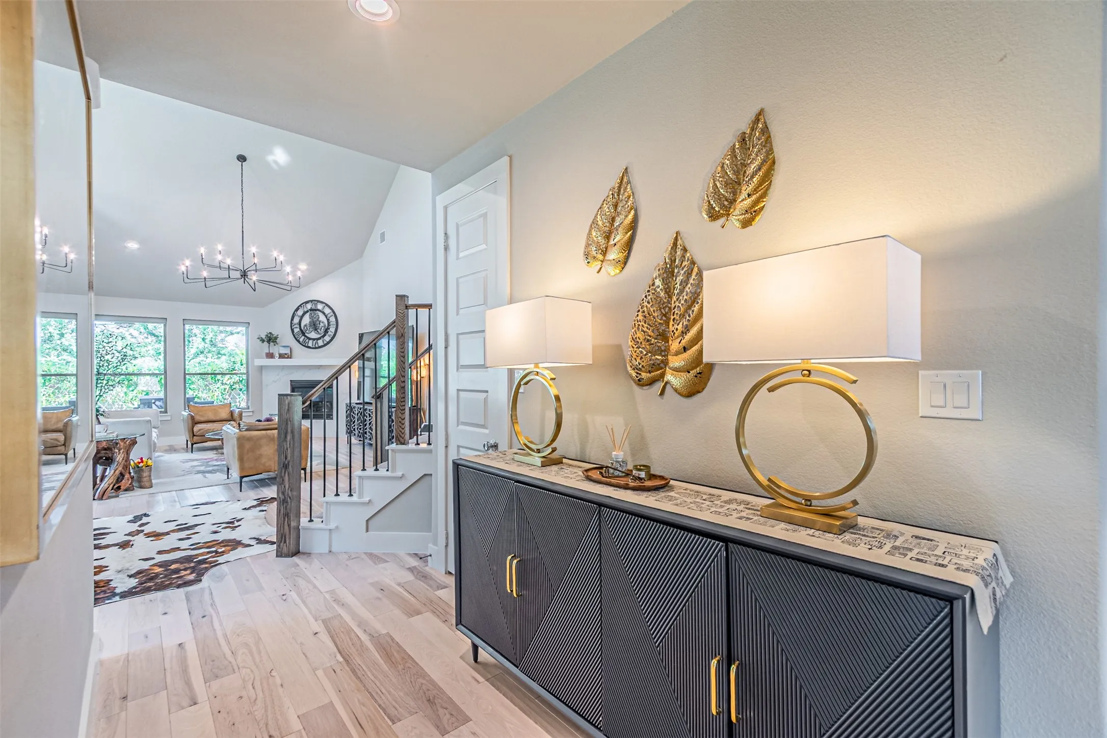 Entryway featuring light wood-finish flooring and a built-in cabinetry console